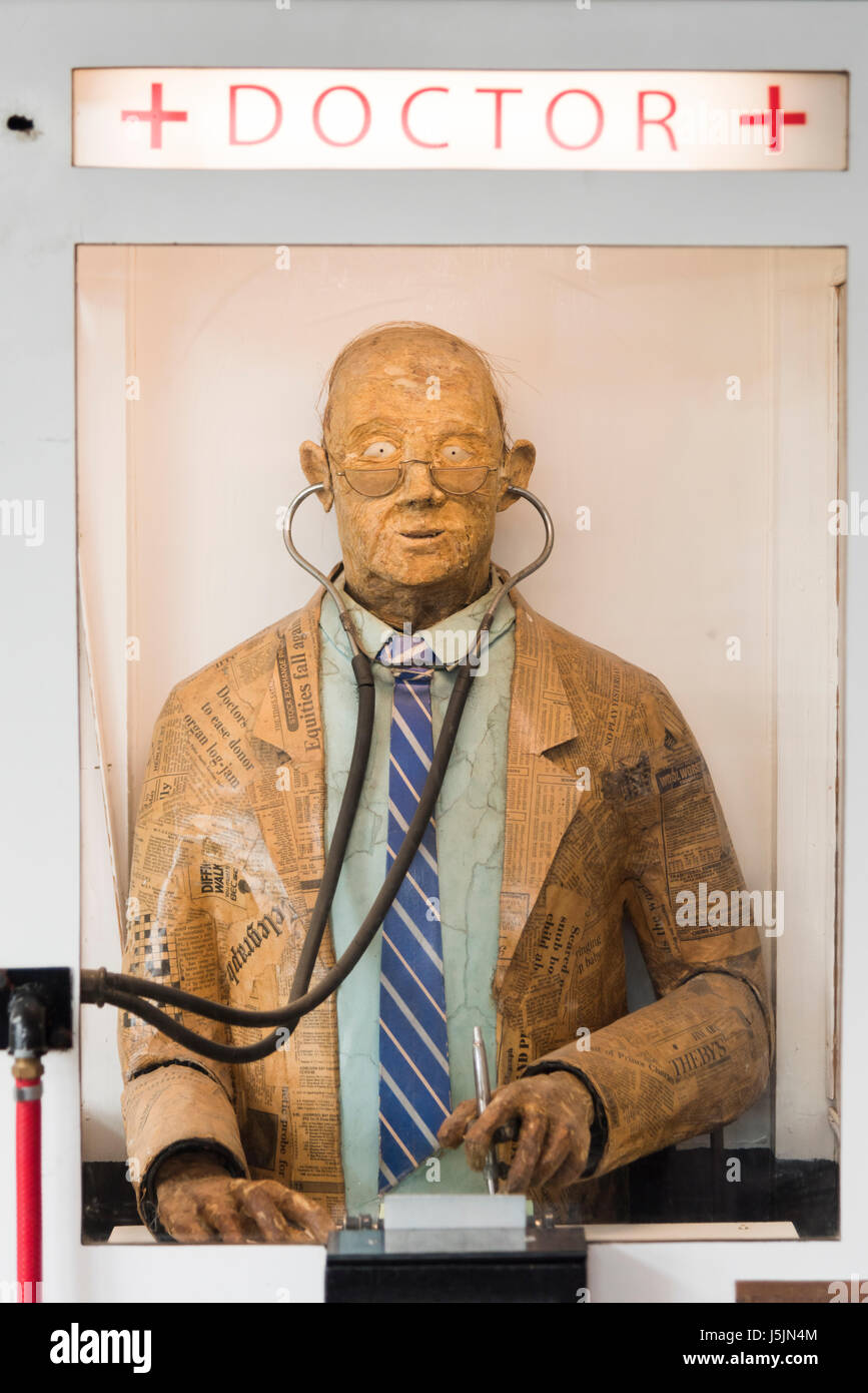 A model of a doctor in an amusement arcade game in the Under the Pier Show on Southwold Pier Suffolk UK Stock Photo