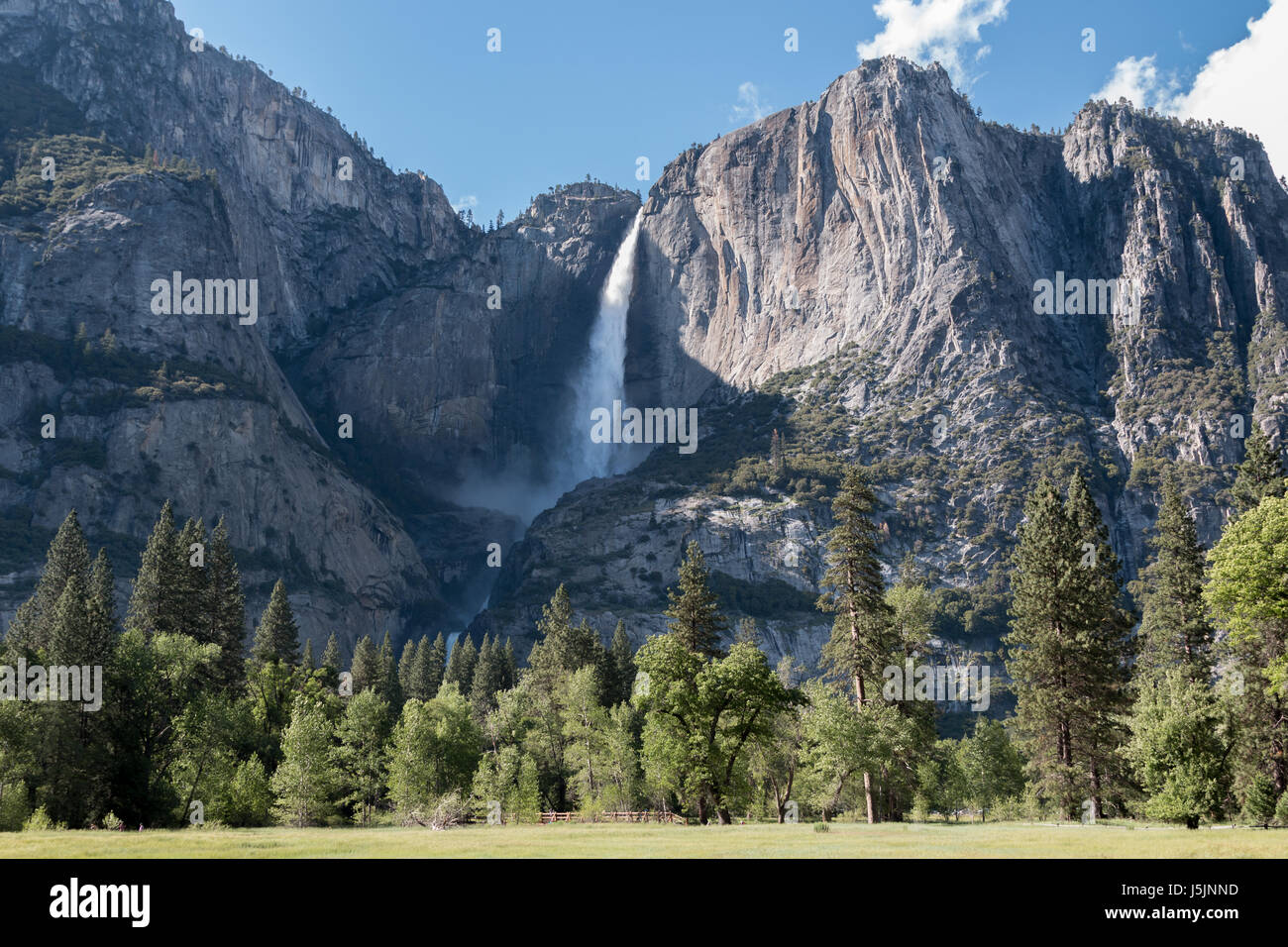 View Of El Capitan With Waterfall And Park In The Foreground Stock