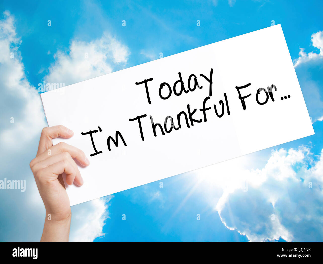 Today I'm Thankful For..Sign on white paper. Man Hand Holding Paper with text. Isolated on sky background. Life, Business concept. Stock Photo Stock Photo