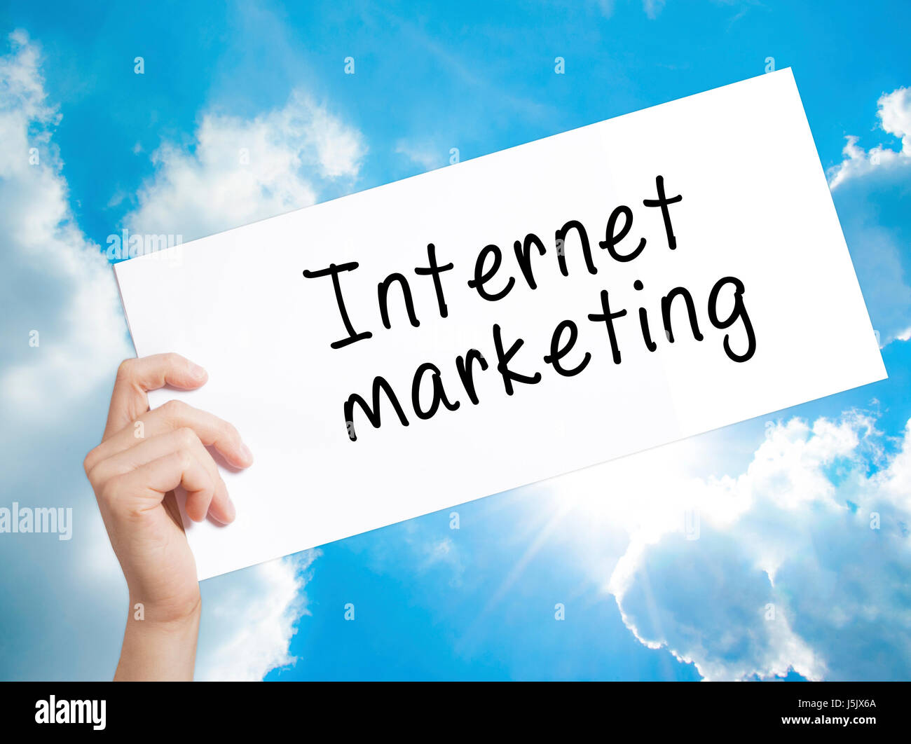 Internet marketing Sign on white paper. Man Hand Holding Paper with ...