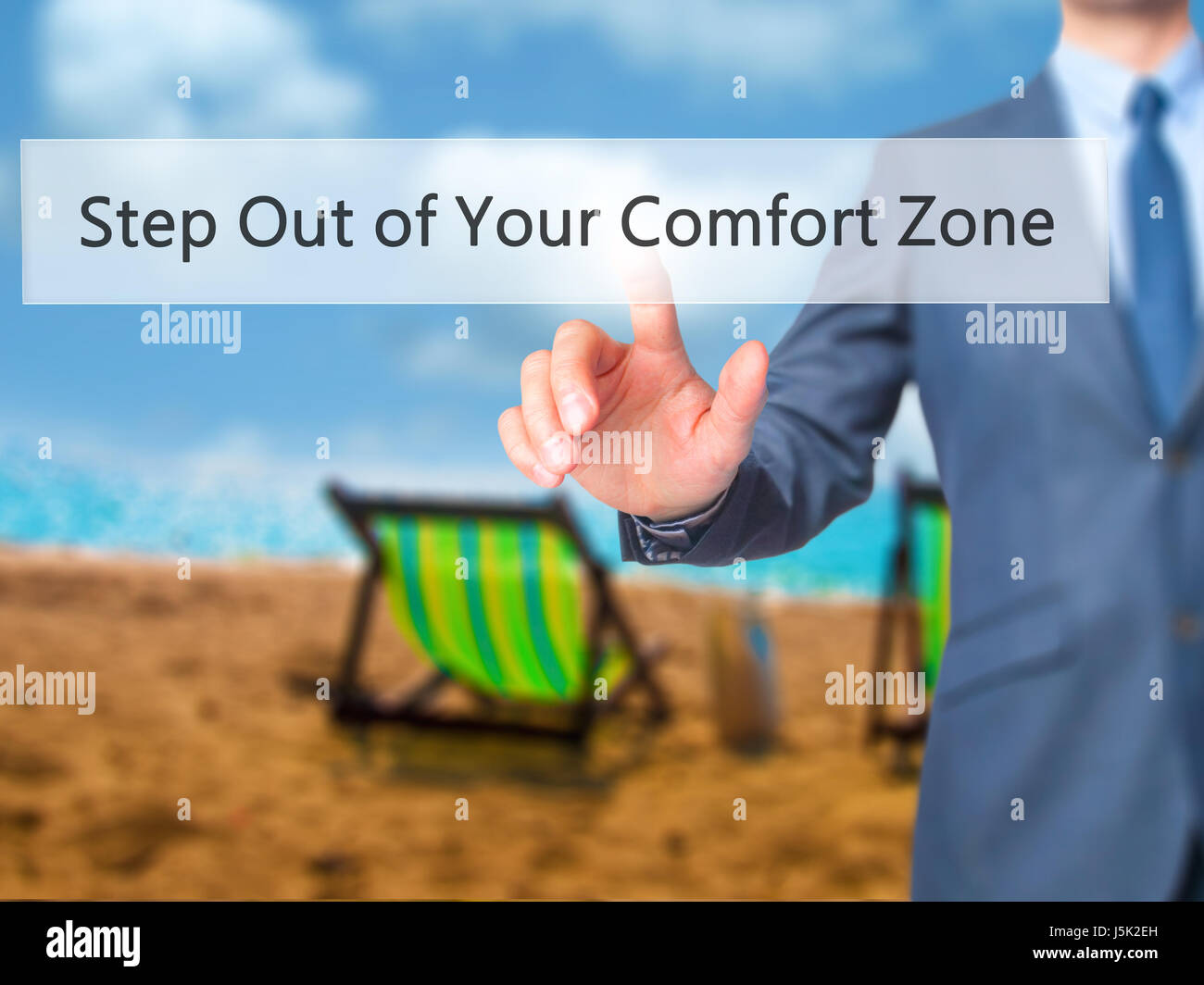 Step Out of Your Comfort Zone - Businessman hand pressing button on touch screen interface. Business, technology, internet concept. Stock Photo Stock Photo