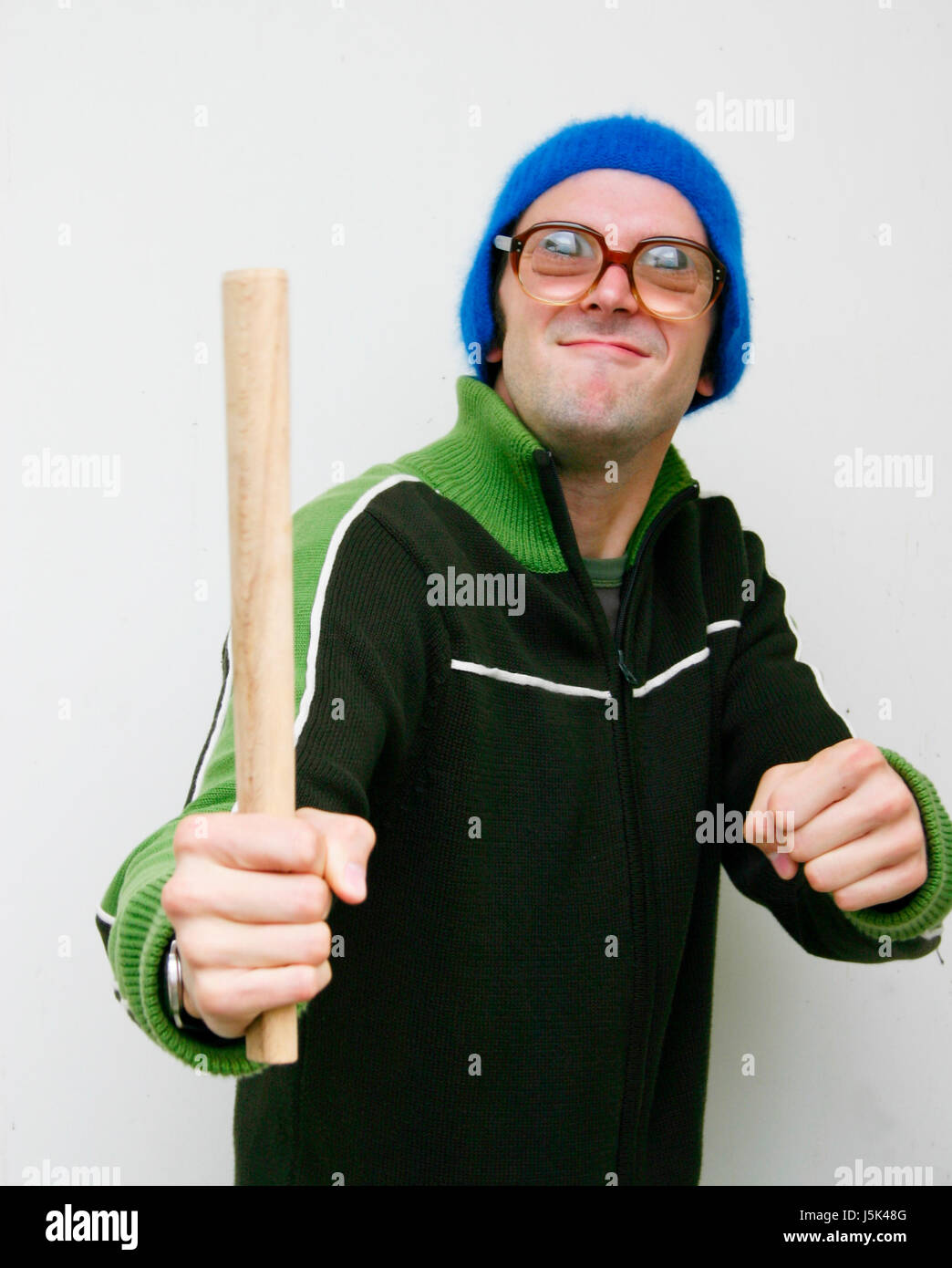 young man with a stick and glasses Stock Photo