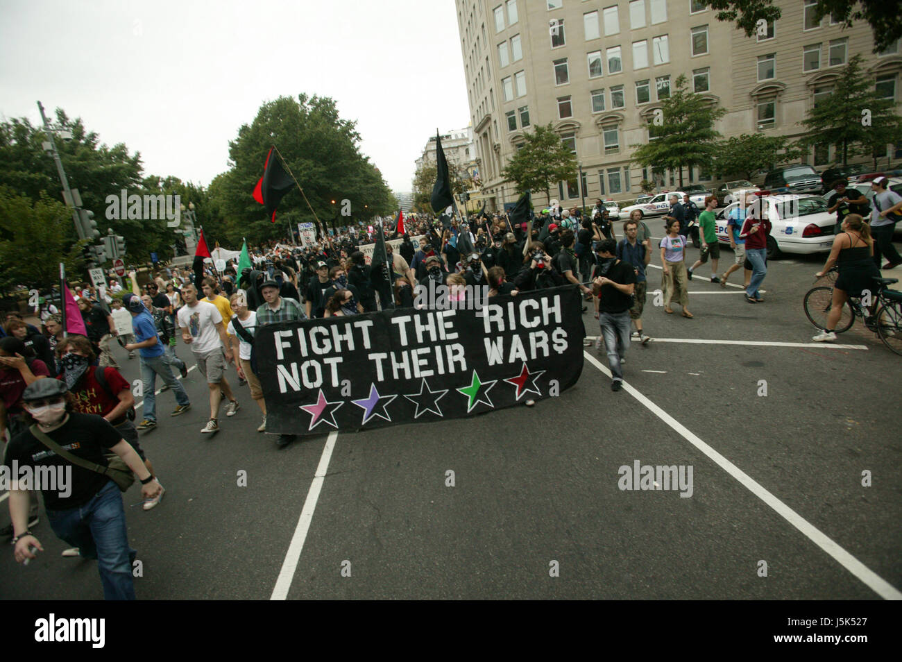 Black Bloc Anarchists take over a street during the anti-war march on Washington. Stock Photo