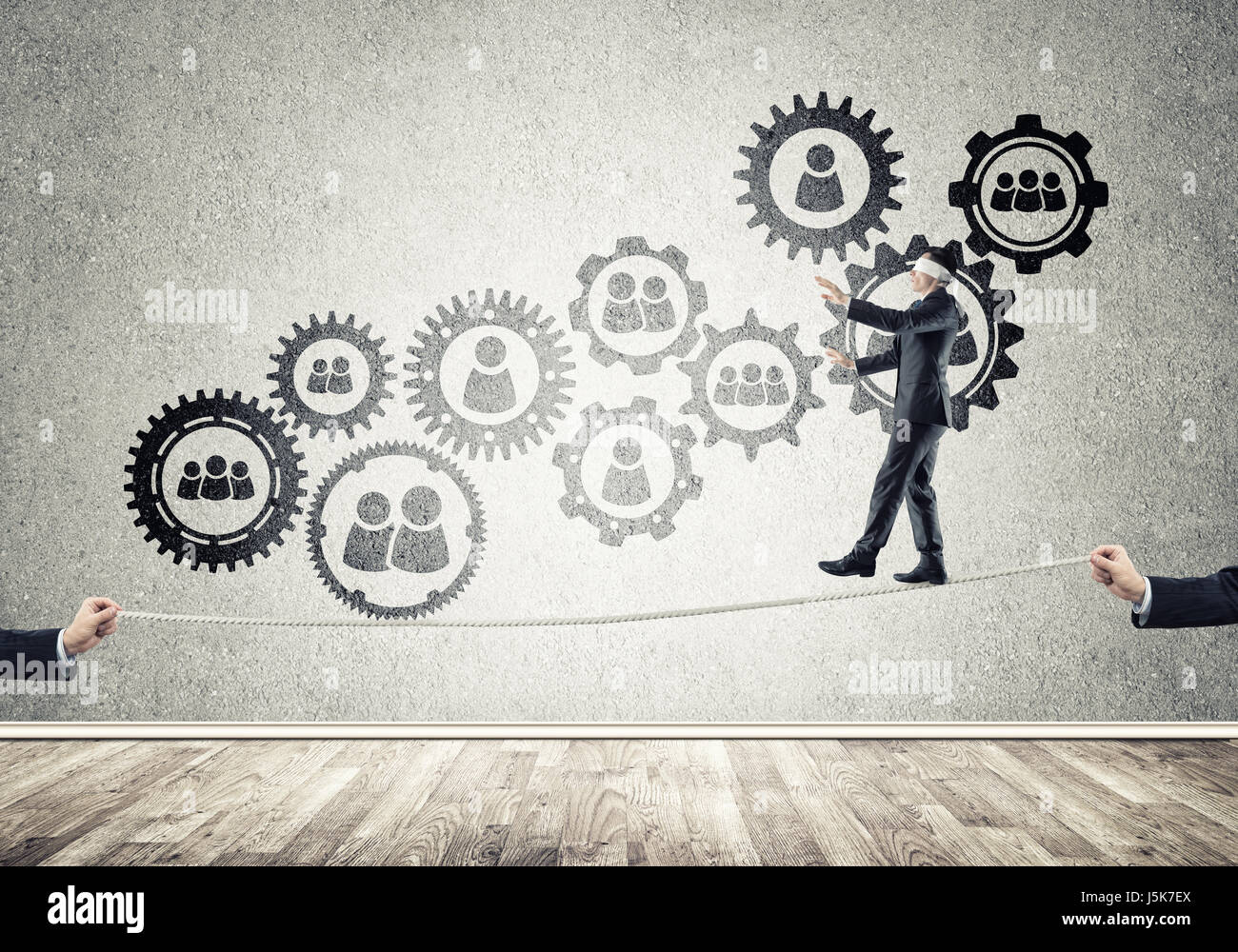 Business concept of risk support and assistance with man balancing on ...