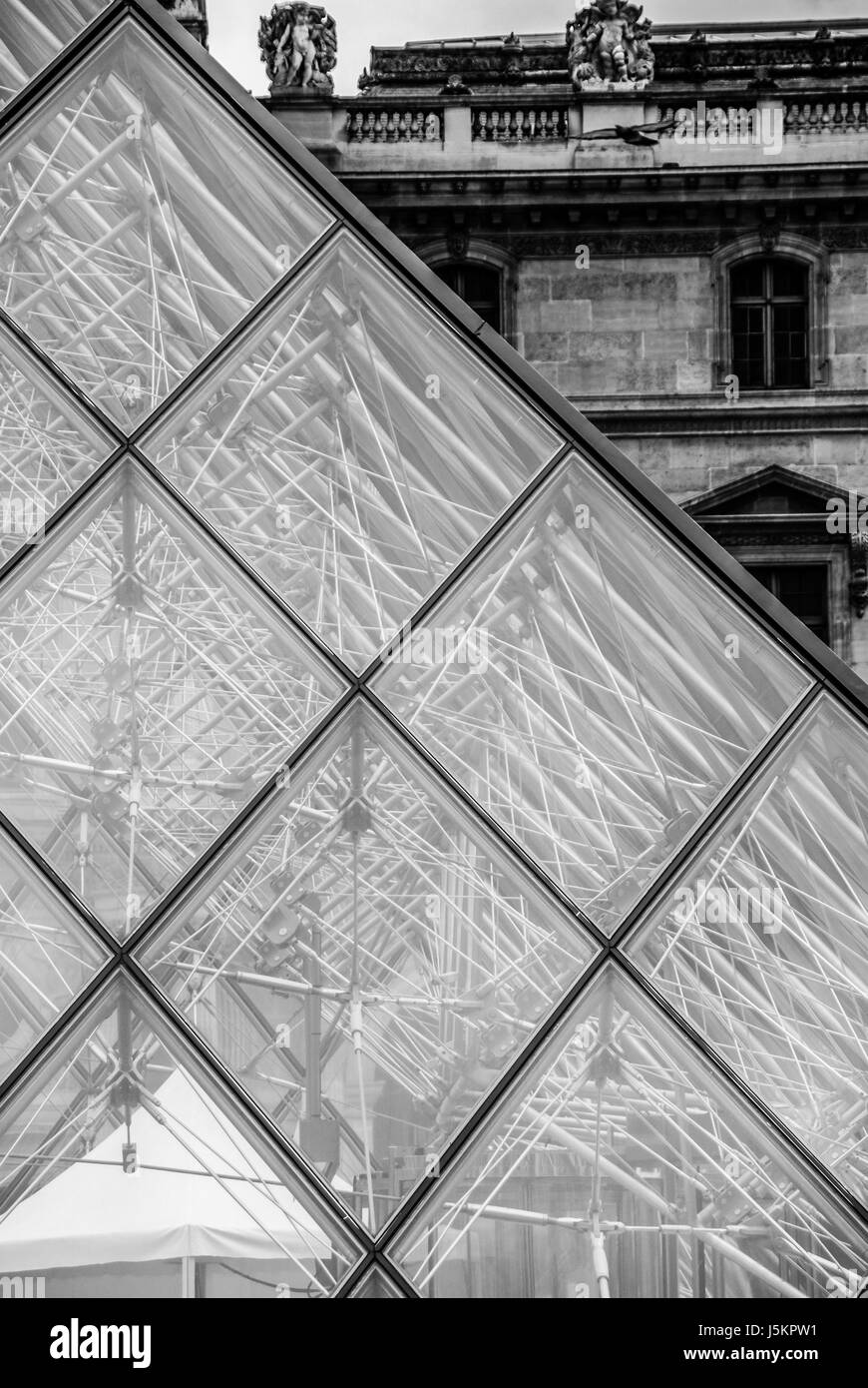 Glass pyramid at Louvre Paris Pyramide du Louvre black and white Stock Photo