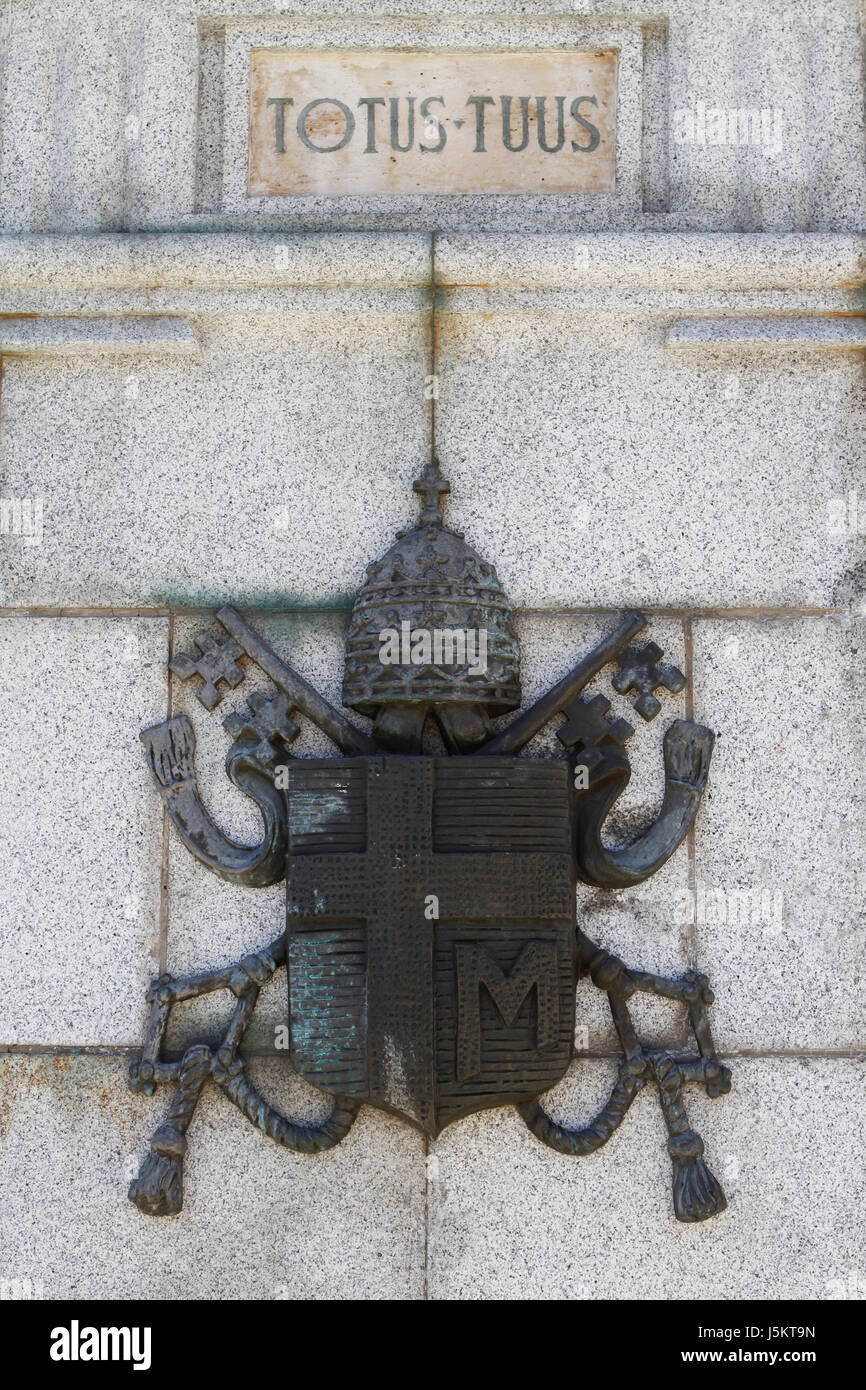 An insignia on a wall outside the Almudena Cathedral in Madrid, Spain Stock Photo