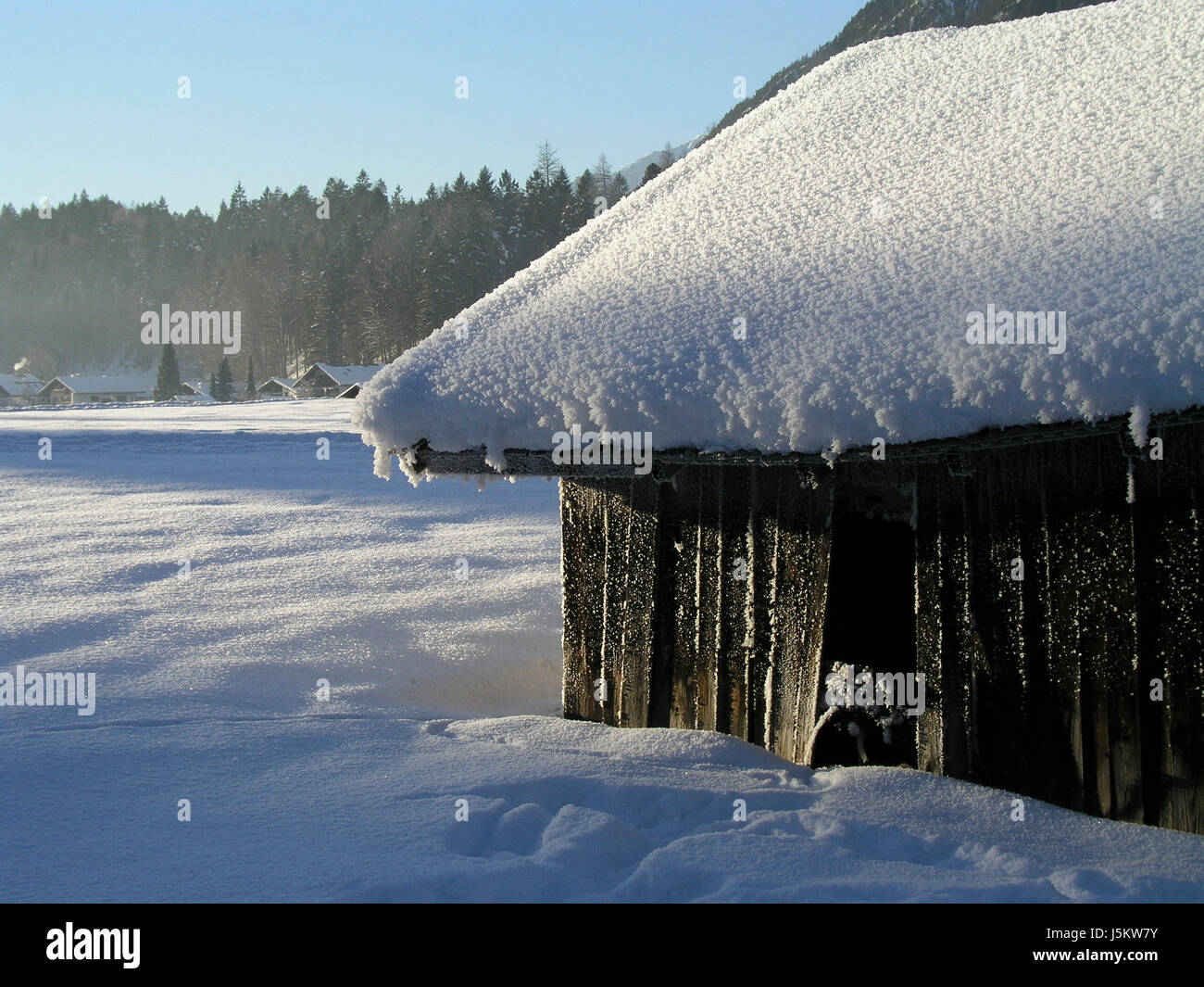 winter ice barn snow lodge hut winterlamdschaft almhtte schnebedeckt Stock Photo