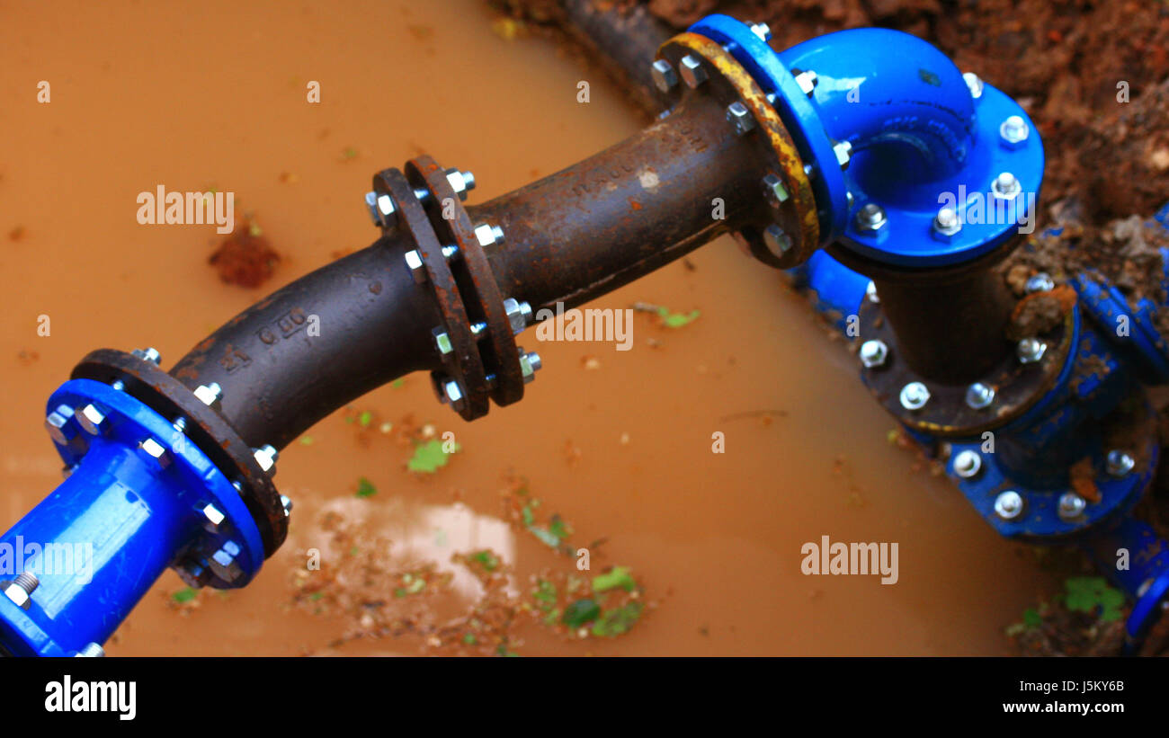 blue screws water pipes rainwater screwed ground water cable current conduction Stock Photo