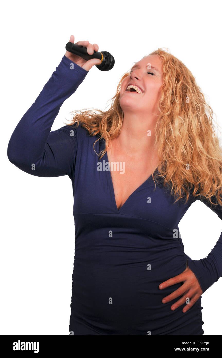 Middle age woman singer performing at a concert Stock Photo - Alamy