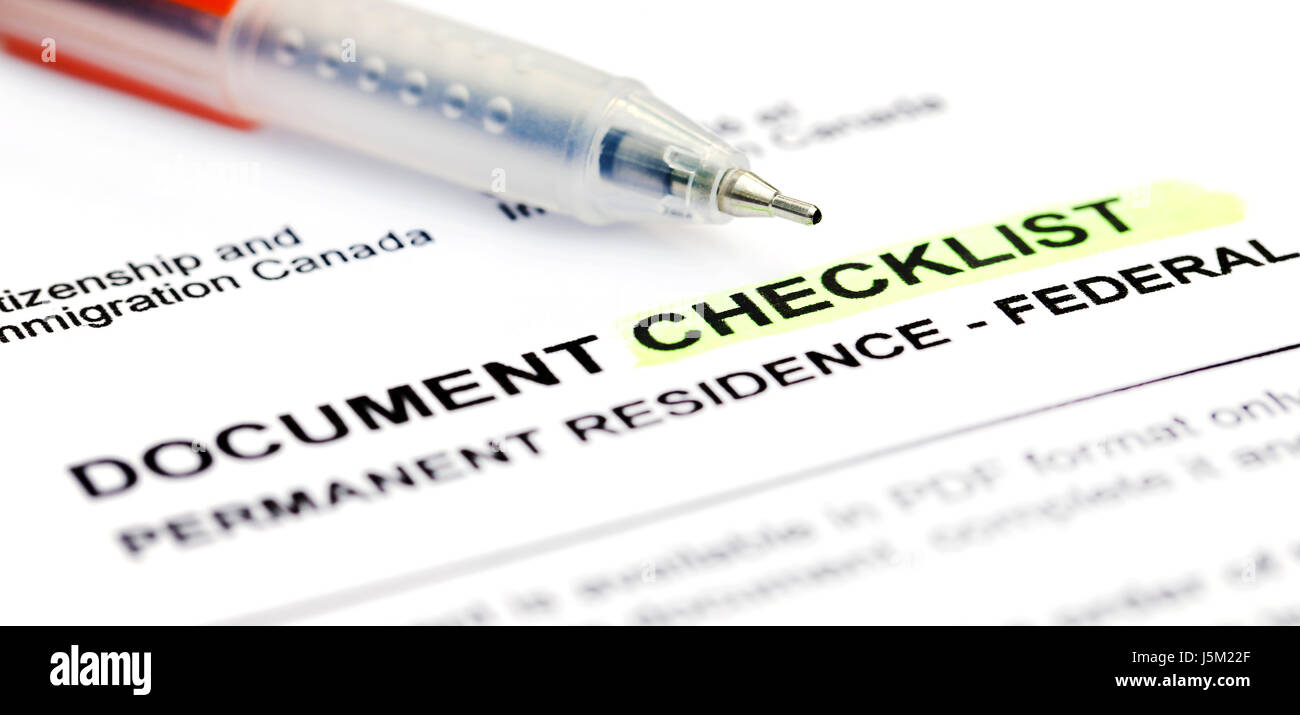 Document checklist for Visa application Canada with a ballpoint Stock