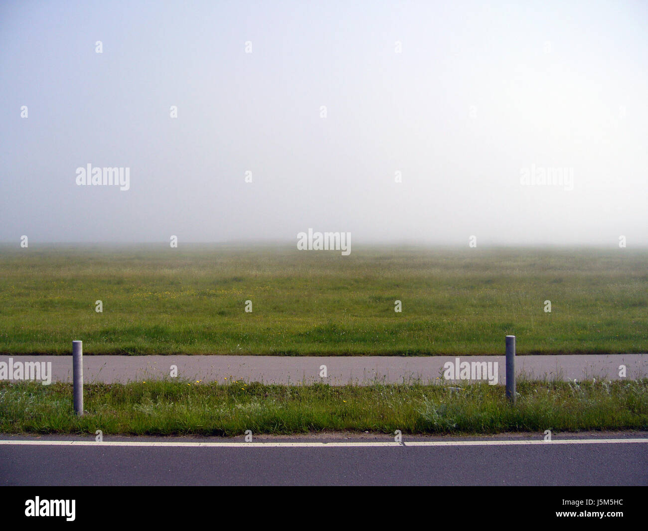 horizon fog across asphalt spring reprove horizontal cycle track path way Stock Photo