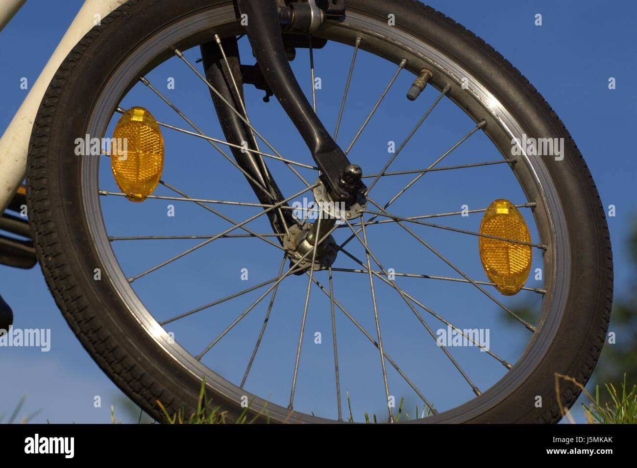 drive wheel cat eyes spoke scar front wheel spokes rims valve ferries bike  Stock Photo - Alamy