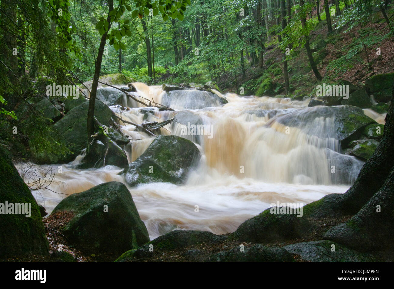 small waterfall at high water Stock Photo - Alamy