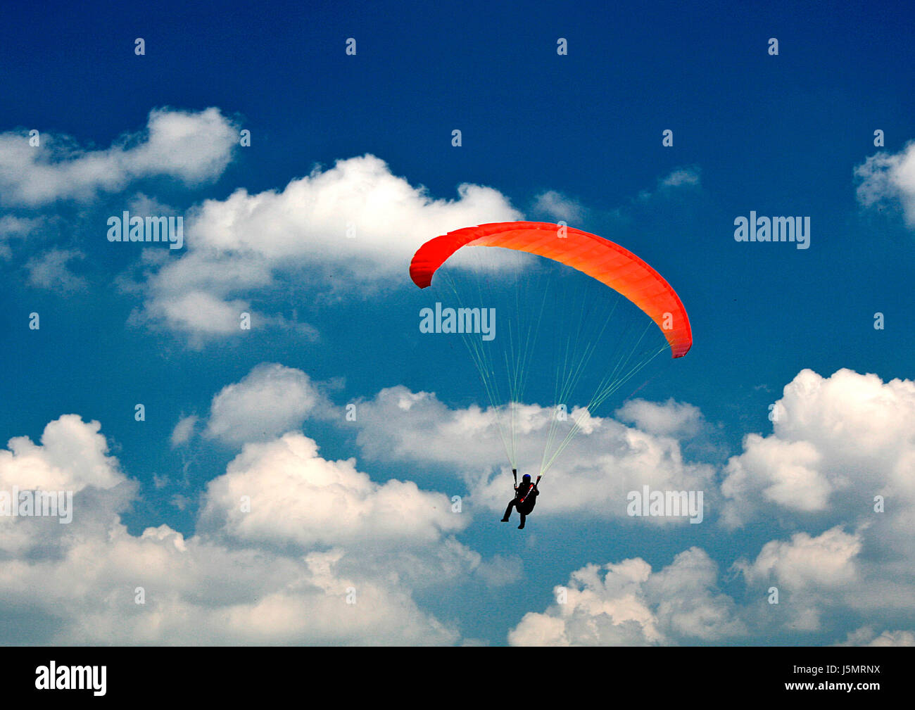 paragliders in the sky Stock Photo