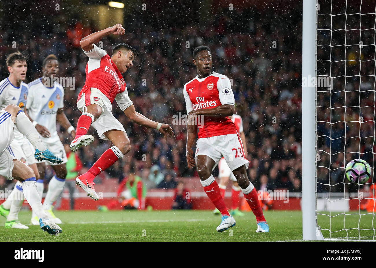 Alexis Sanchez of Arsenal scores to make it 2-0 during the Premier League match between Arsenal and Sunderland AFC at the Emirates Stadium in London. 16 May 2017 EDITORIAL USE ONLY No merchandising. For Football images FA and Premier League restrictions apply inc. no internet/mobile usage without FAPL license - for details contact Football Dataco Arron Gent /TELEPHOTO IMAGES Stock Photo