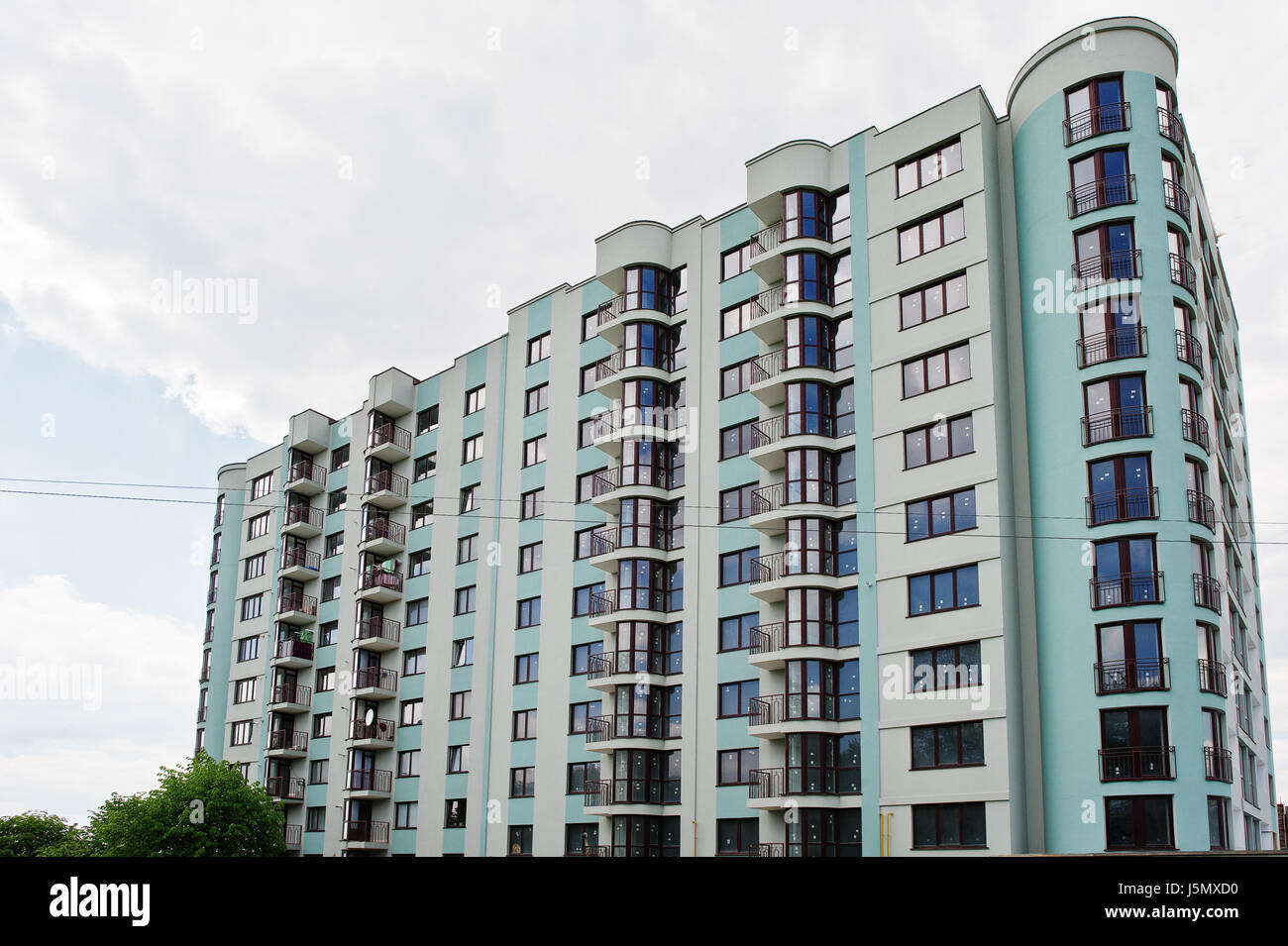 Balcony of new modern turquoise multi storey residential building house ...