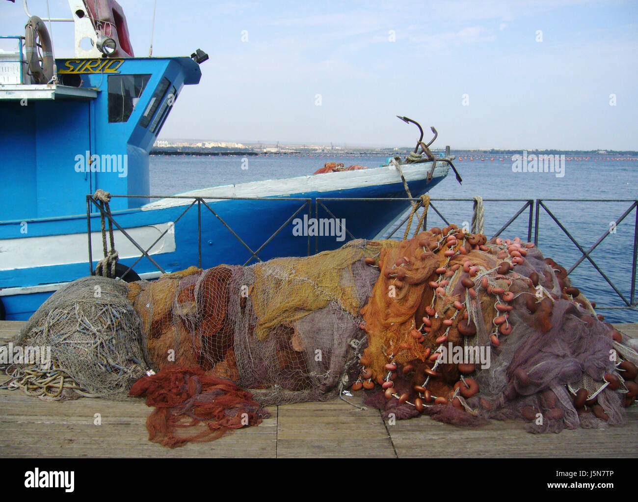 net adriatic sea fishing ship nets plank salt water sea ocean water fishing net Stock Photo