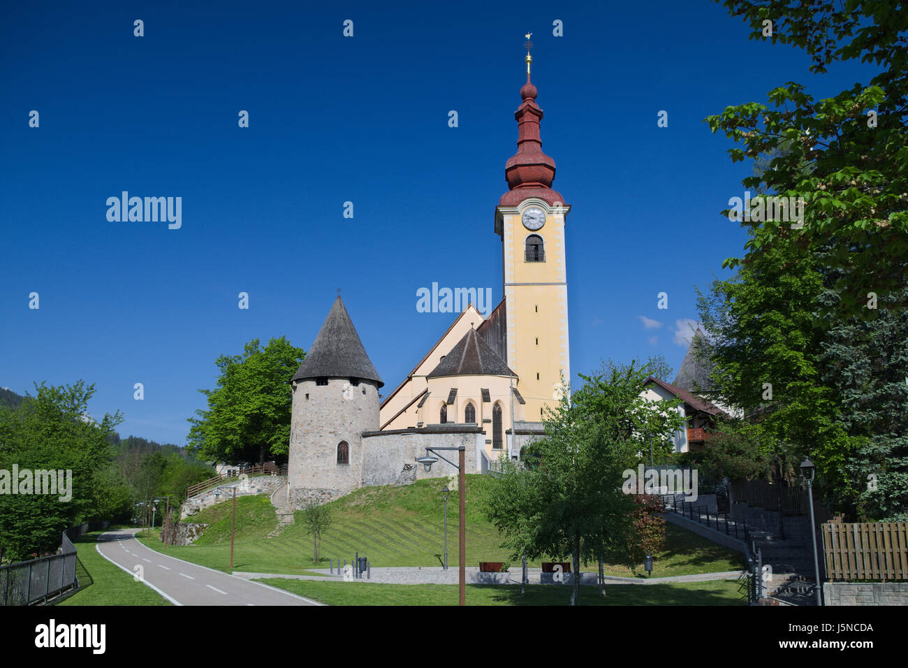 Parish Church of Saint Peter and Paul in Tarvisio: an example of an Alpine fortified church Stock Photo
