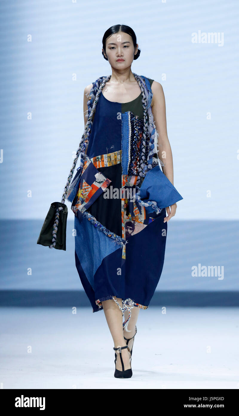 Beijing, China. 18th May, 2017. A model presents a creation designed by ...