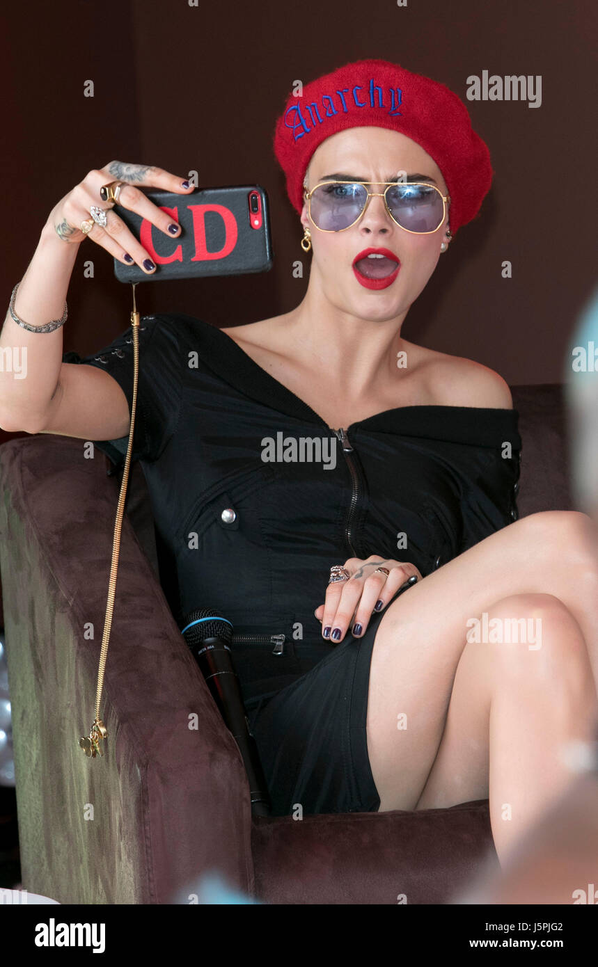 Cannes, France. 18th May, 2017. Model Cara Delevigne presents her participation of Magnum X Maschino during the 70th Annual Cannes Film Festival at Plage l'Ondine in Cannes, France, on 18 May 2017. - NO WIRE SERVICE · Photo: Hubert Boesl/dpa Credit: dpa picture alliance/Alamy Live News Stock Photo