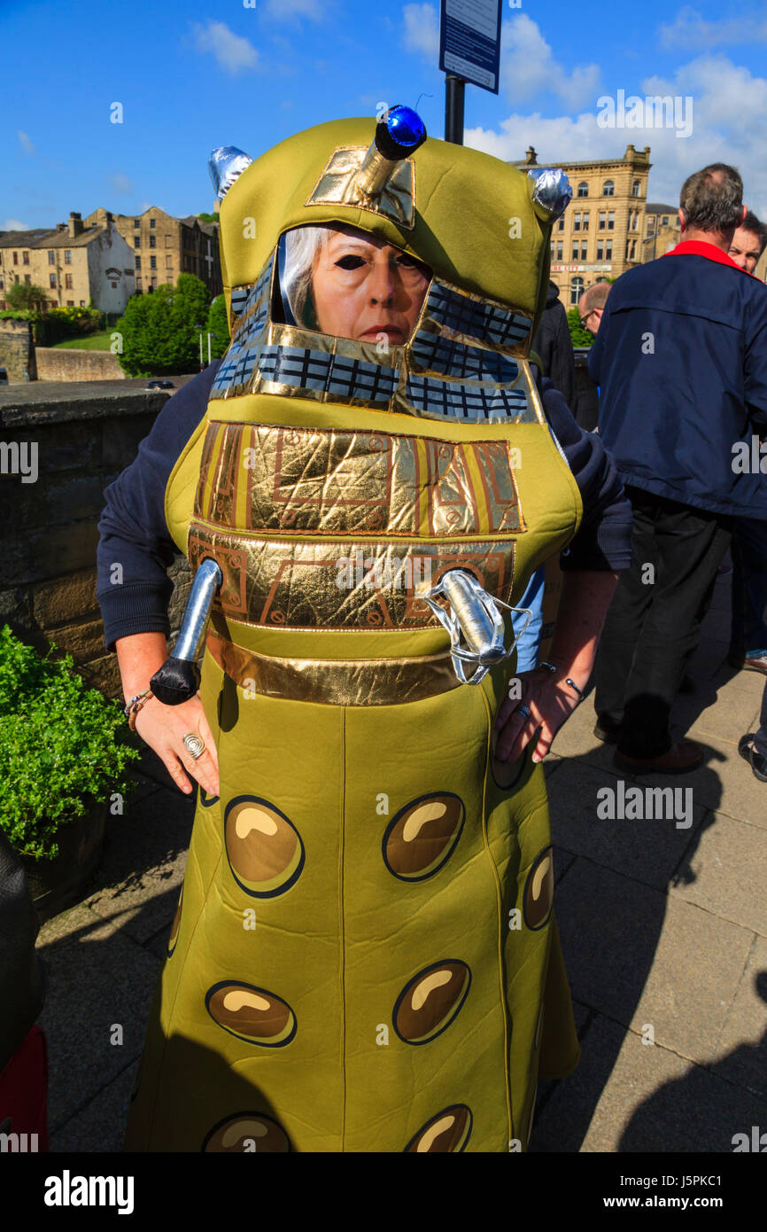 Halifax, UK. 18th May, 2017. Halifax, West Yorkshire, UK. 18th May, 2017. A demonstrator dressed as a Dalek poses with police officers during the demonstration aginst the Conservative Party manifesto launch in Halifax, England. 18th may 2017. Credit: Graham Hardy/Alamy Live News Credit: Graham Hardy/Alamy Live News Stock Photo