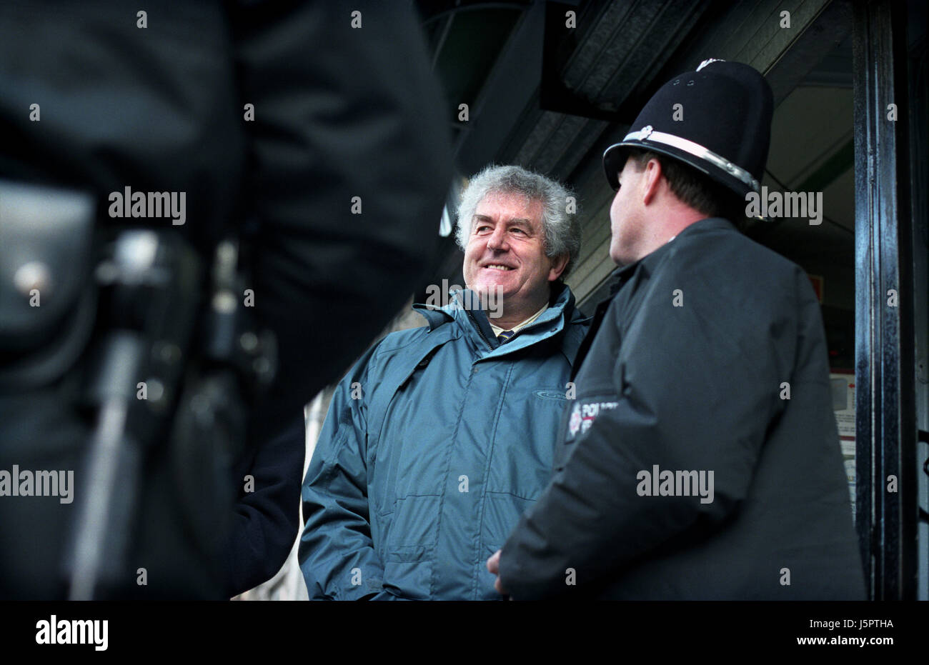 Rhodri Morgan (Labour) the former First Minister of the Welsh Assembly Government (2000 - 2009), meeting policeman during campaigning the second Welsh Assembly Elections. He was largely known as the 'Father of Devolution'. Kiran Ridley/Ethos Stock Photo