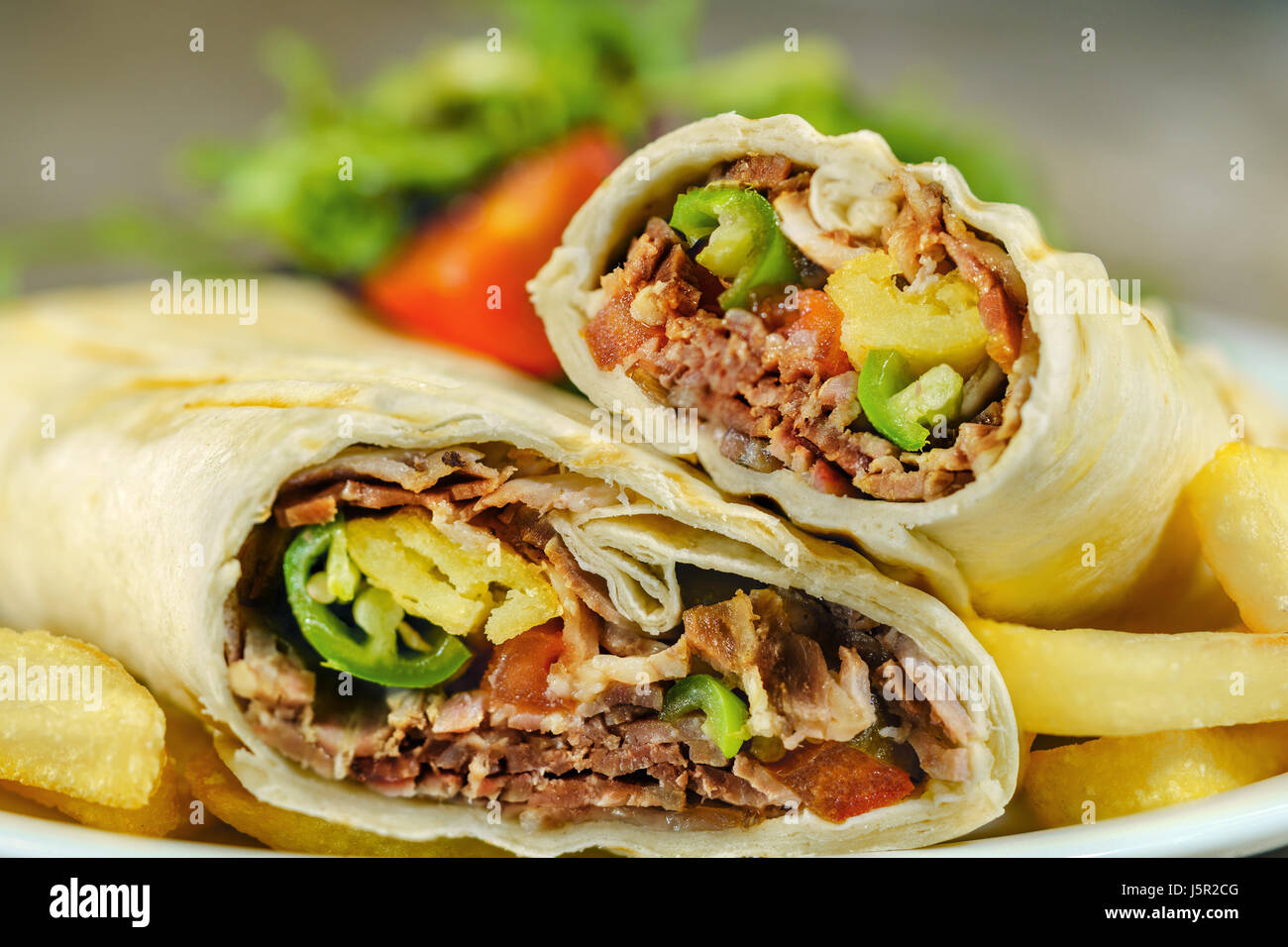 Traditional turkish fast food. Döner Kebap is wrapping. Stock Photo