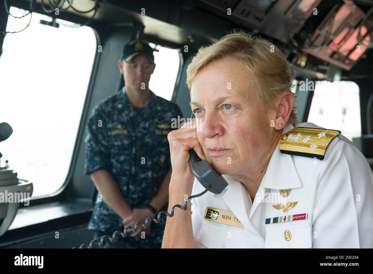 U.S. Navy Commander Nora Tyson addresses sailors through the announcing system aboard the USN Independence-class littoral combat ship USS Coronado at the Changi Naval Base April 4, 2017 in Changi, Republic of Singapore.    (photo by MCS2 Amy M. Ressler /US Navy  via Planetpix) Stock Photo