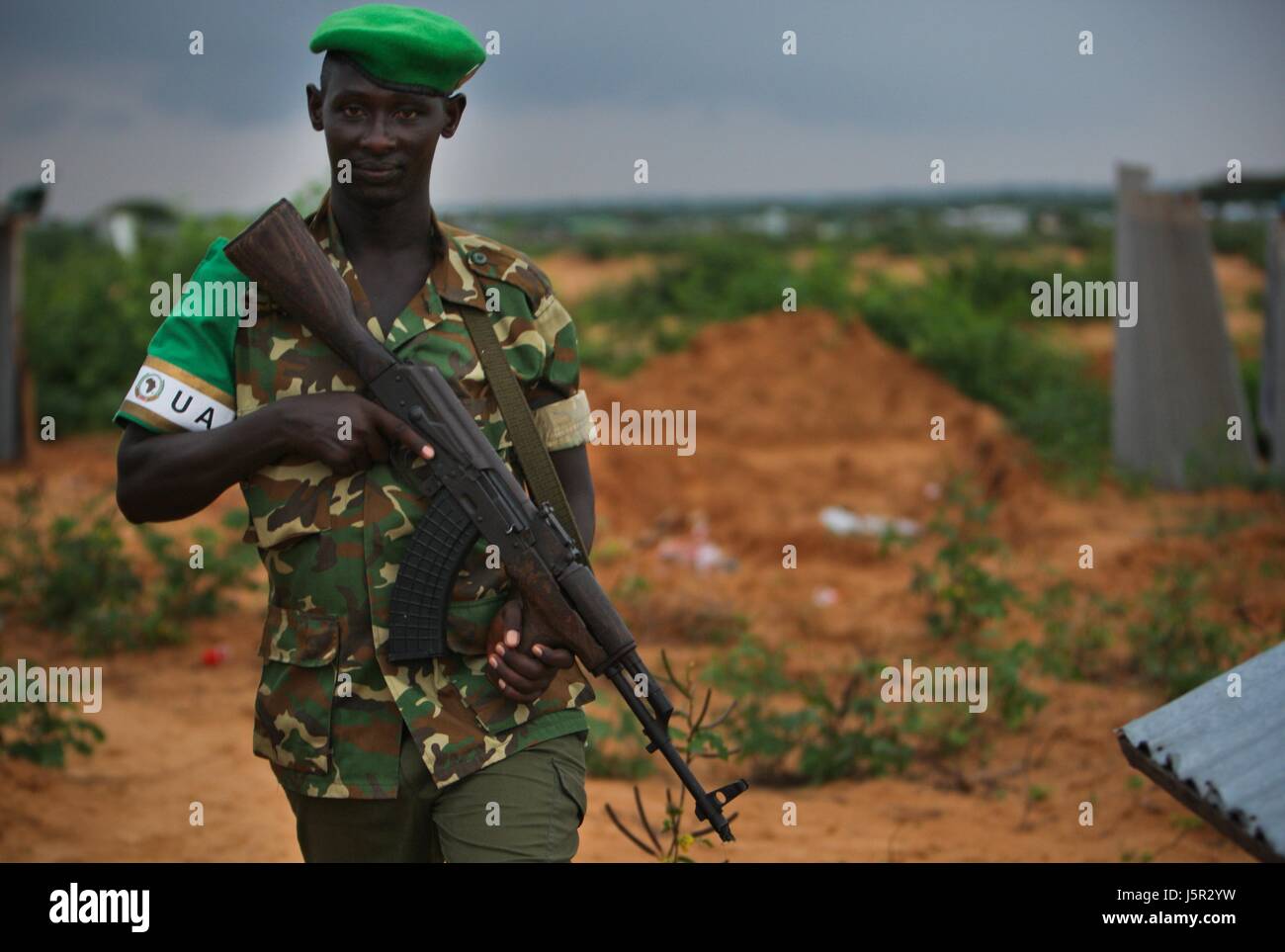 An African Union Mission in Somalia (AMISOM) Burundian soldier patrols the frontline in a territory recently captured from insurgents in the Deynile District November 17, 2011 near Mogadishu, Somalia.    (photo by Stuart Price/ANISOM via Planetpix) Stock Photo