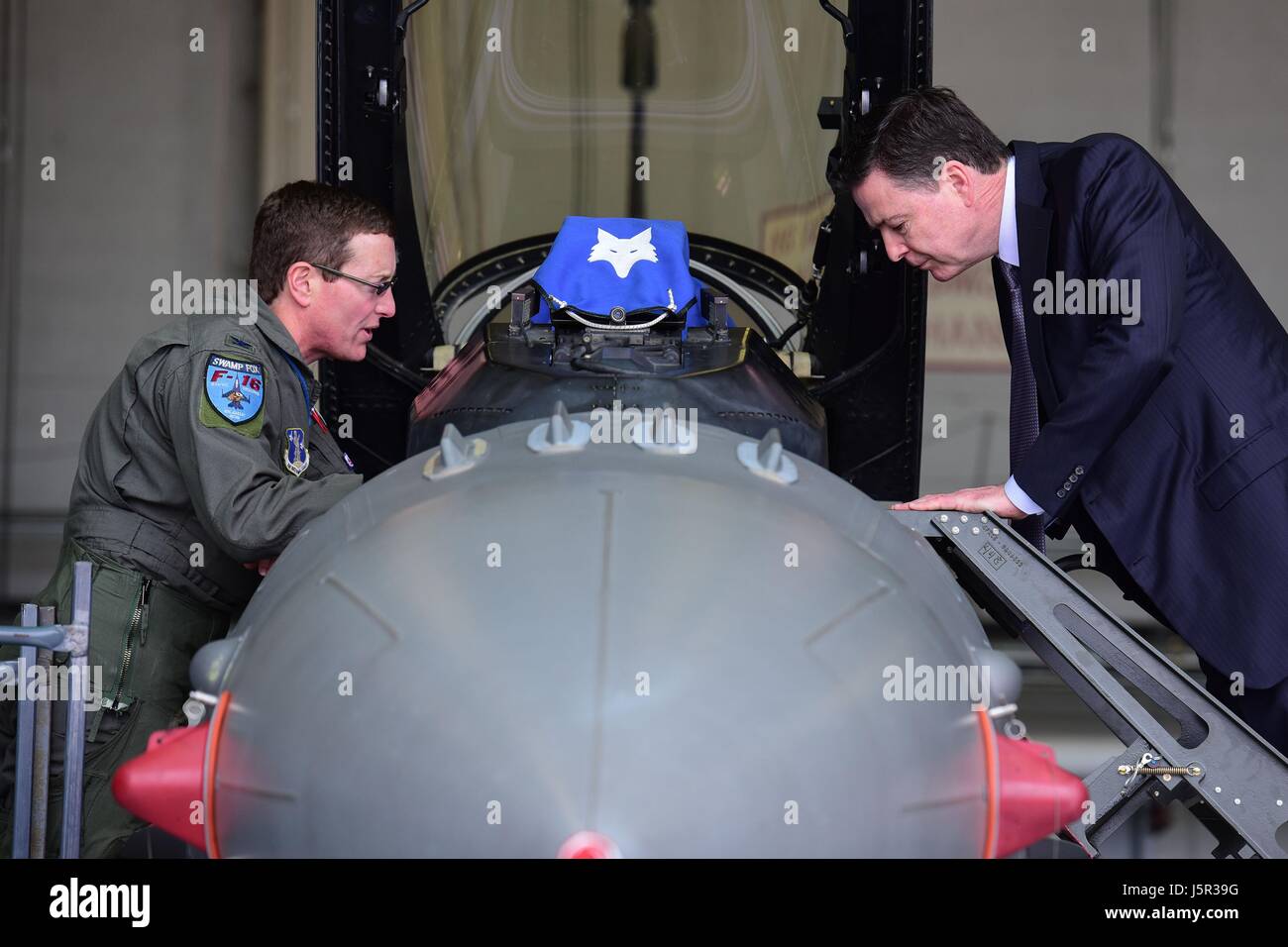 USAF Commander Nicholas Gentile Jr., (left) shows Federal Bureau of Investigation Director James Comey a F-16 Fighting Falcon jet fighter aircraft at the McEntire Joint National Guard Base March 22, 2017 in Hopkins, South Carolina.    (photo by Megan Floyd /US Air National Guard  via Planetpix) Stock Photo