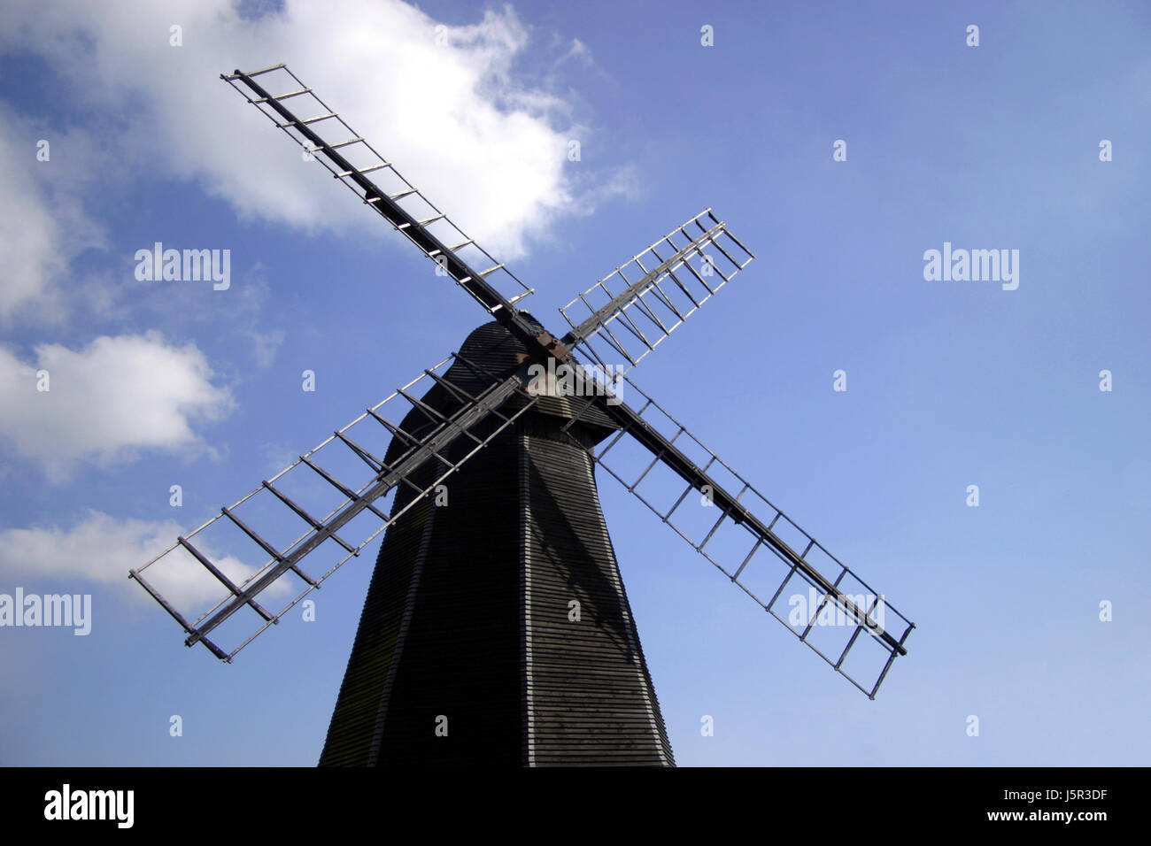 blue wood blank european caucasian england windmill mill firmament sky clouds Stock Photo