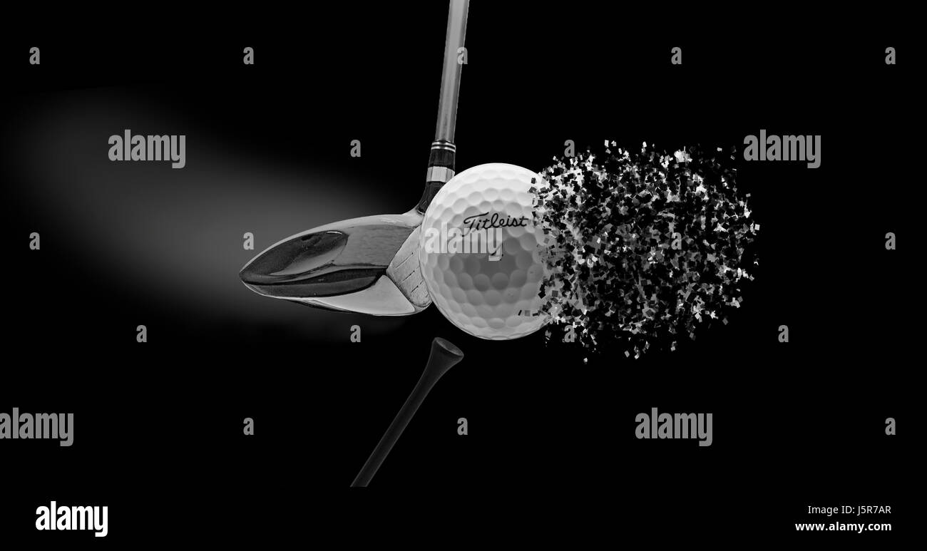 Creative shot of a golf ball exploding as it is hit by a golf club Stock Photo