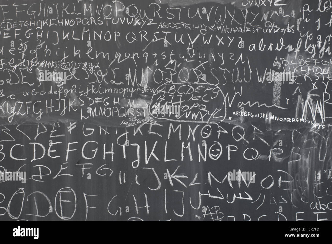 write wrote writing writes blackboard a letter chalk sign alphabet board kreide Stock Photo