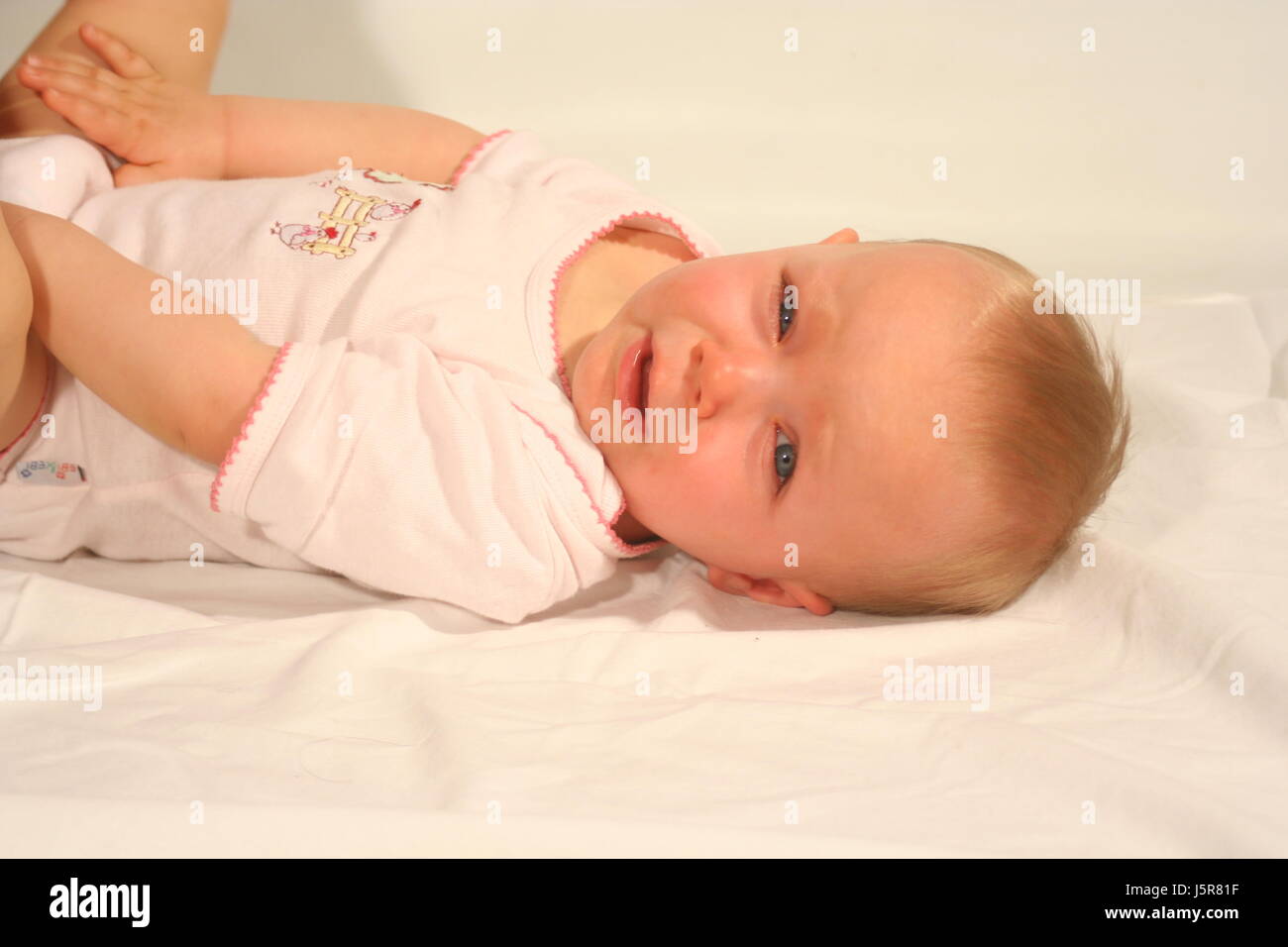 life exist existence living lives circulation lie lying lies baby offspring Stock Photo