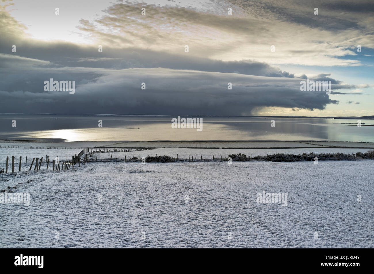 dh Scapa Flow ORPHIR ORKNEY Snow field uk winter scene calm scotland beautiful landscape sky Stock Photo