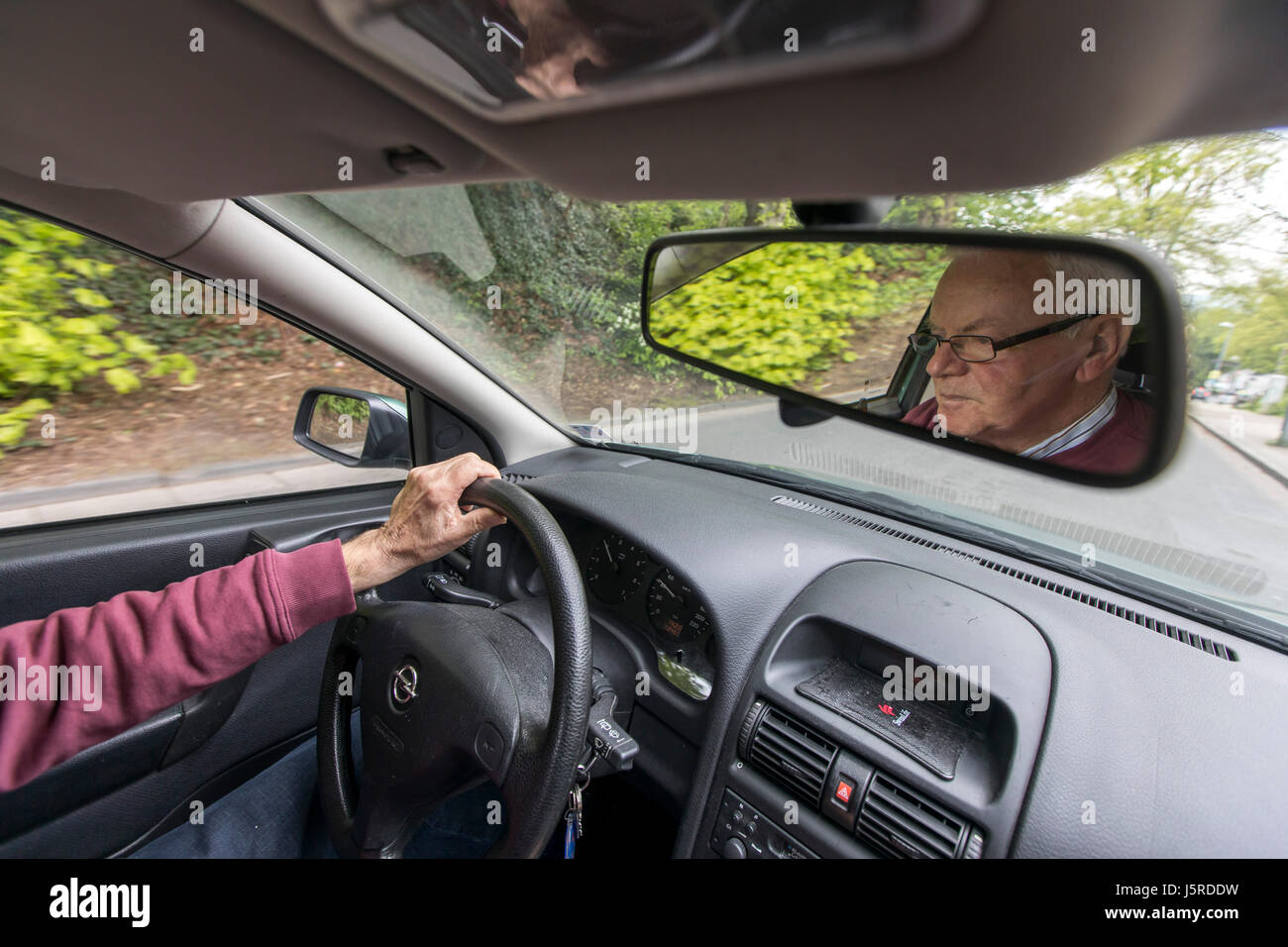 Elderly man driving car hi-res stock photography and images - Alamy