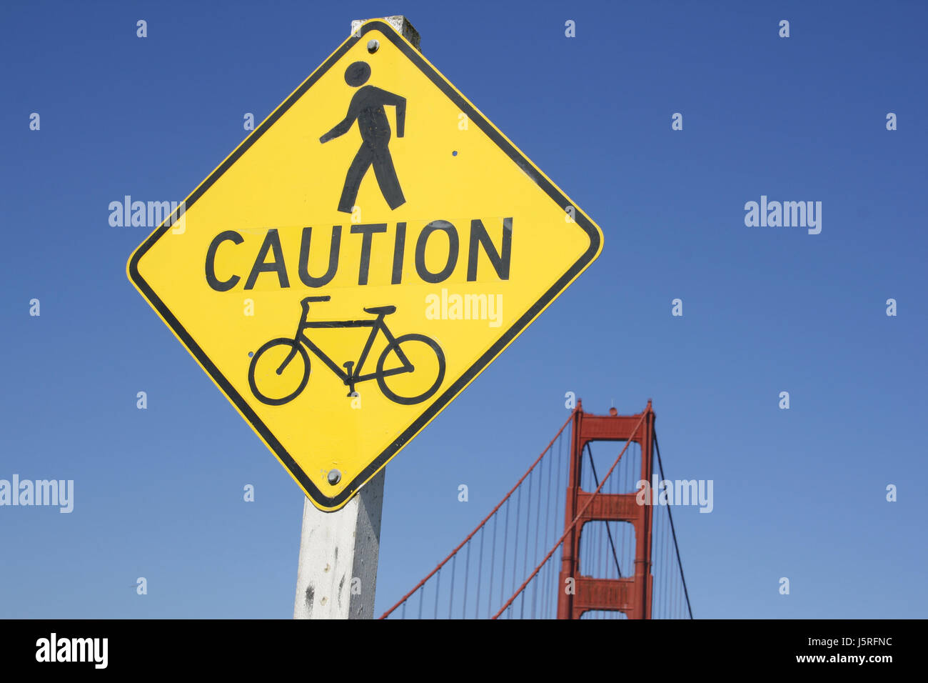 blue city town bridge usa biker california america caution attention stanchion Stock Photo