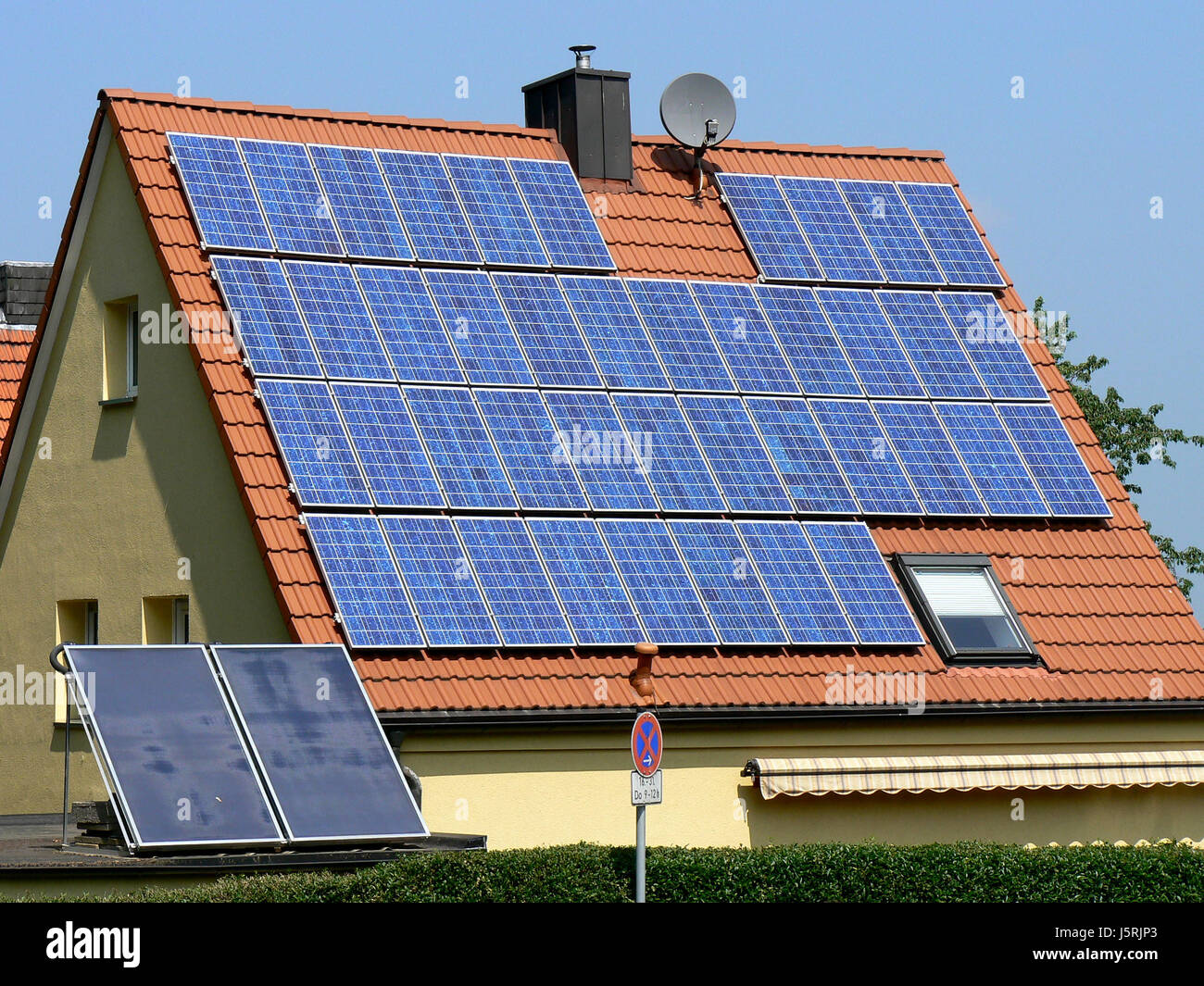 blue house home dwelling house residential building building shine shines Stock Photo