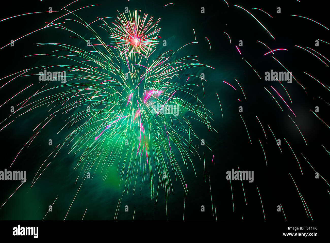 stronghold green celebrate reveling revels celebrates new year rocket spray Stock Photo