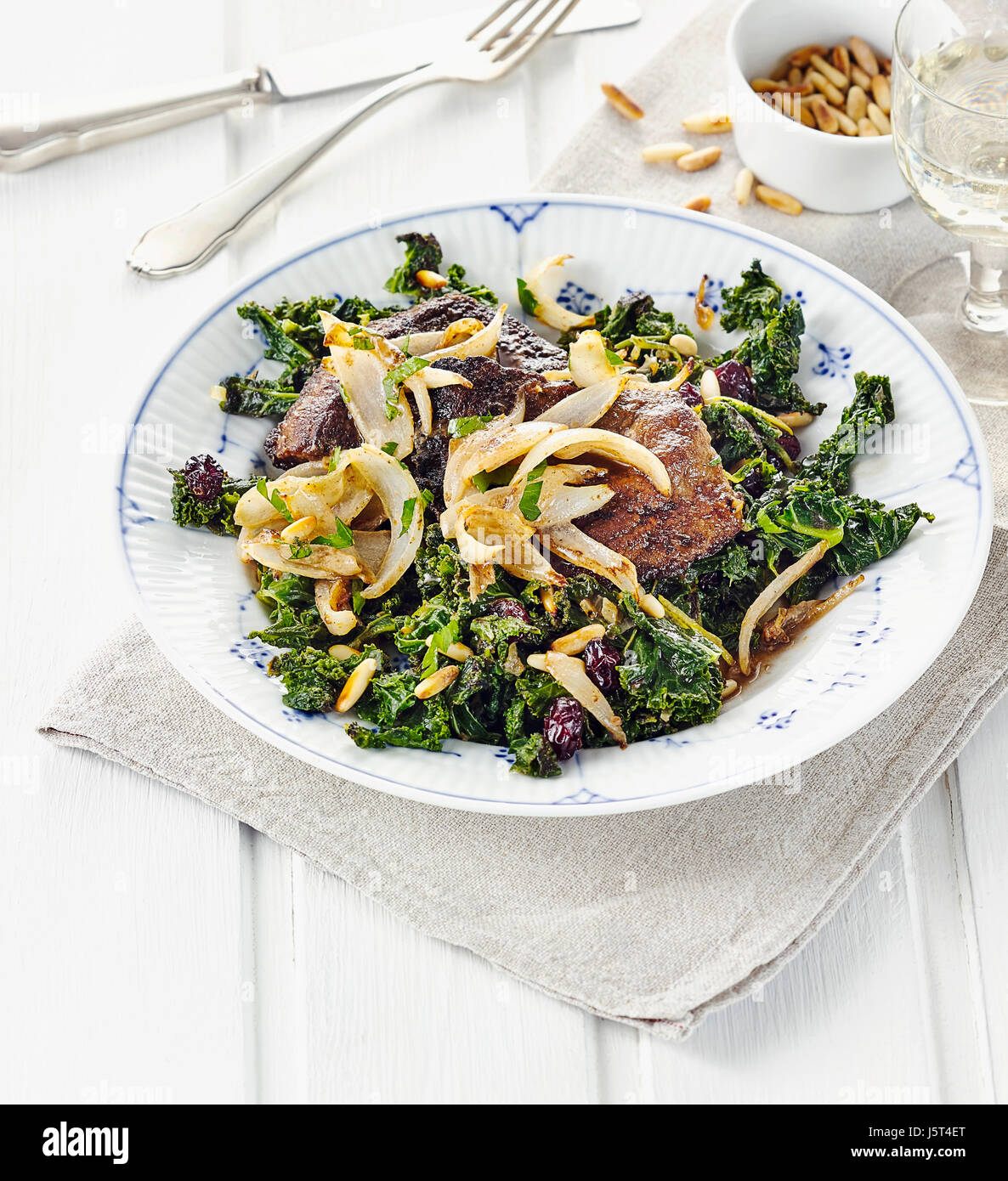 Liver of veal with kale and onions Stock Photo