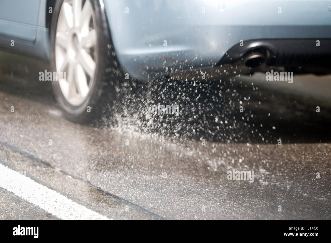car automobile vehicle means of travel motor vehicle aquaplaning street road Stock Photo