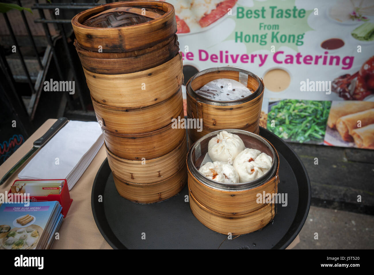 Dim Sum Palace serves steamed dumplings after the unveiling of the new wayfinding kiosks that stand at either end of Restaurant Row in New York, West 46th street between 8th and 9th Avenues, on Tuesday May 16, 2017. At least four years in the making the illuminated kiosks show the names of the many eateries that populate the street. The unveiling is just in time for the Taste of Times Square event taking place on the street on June 5. (© Richard B. Levine) Stock Photo