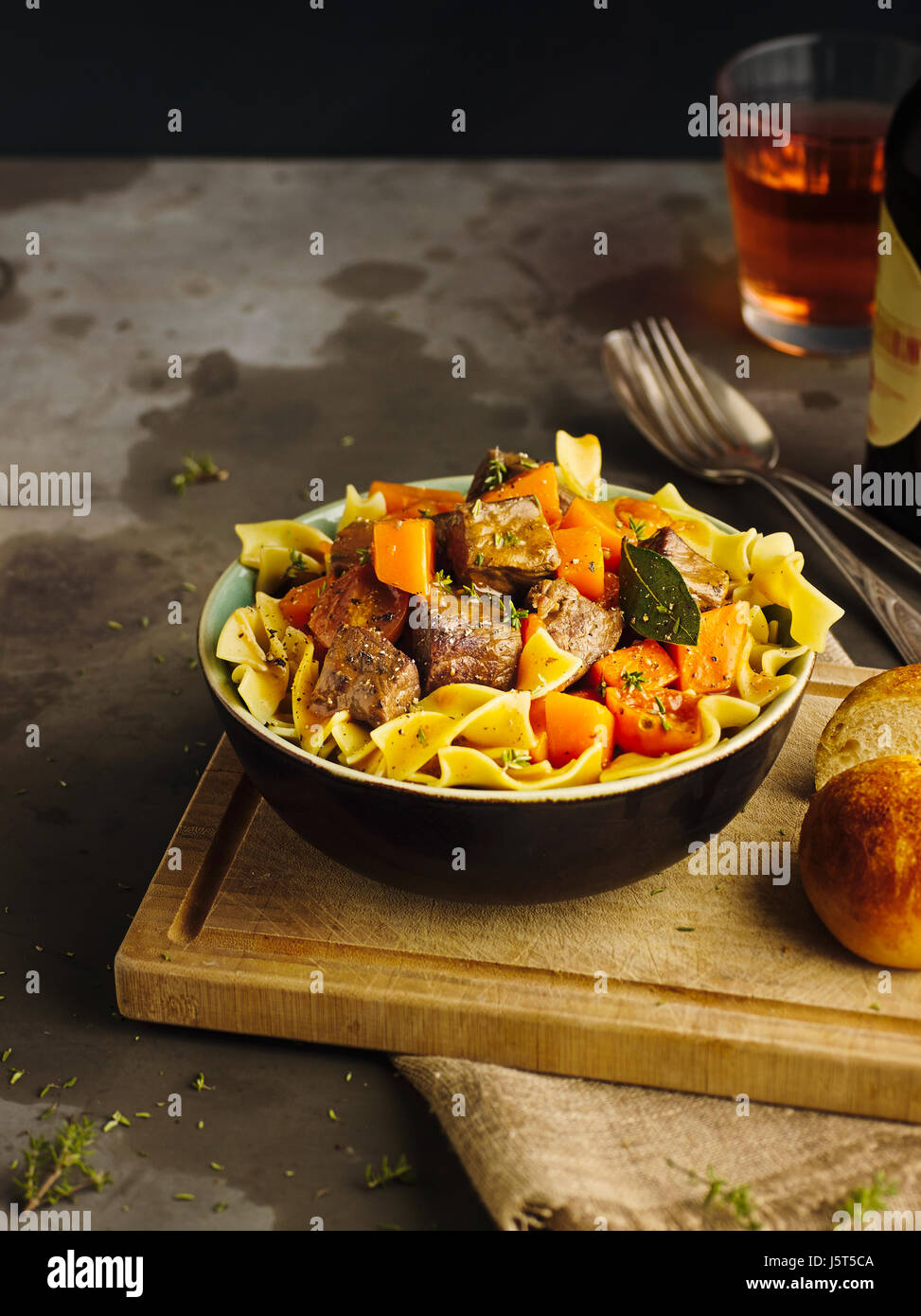 Beef goulash with pumpkin and ribbon noodles Stock Photo - Alamy