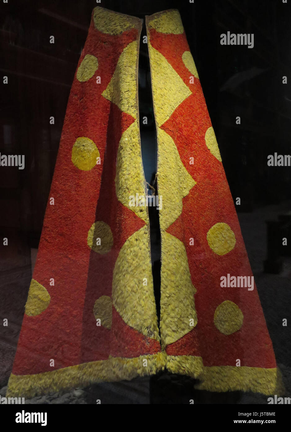 An 'Ahu'ula, a traditional Hawaiian feather cloak, housed at the Bishop Museum. These cloaks were worn by Hawaiian royalty and are known for their intricate designs and cultural significance in Hawaiian heritage. Stock Photo