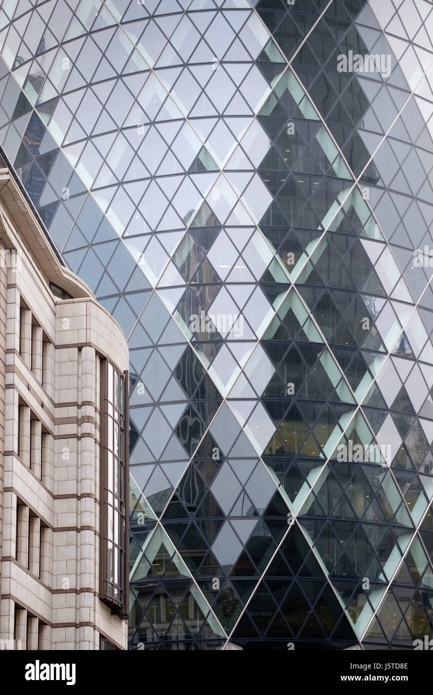 30 St Mary Axe is a commercial skyscraper in London's primary financial district, the City of London. It was completed in December 2003 and opened in  Stock Photo