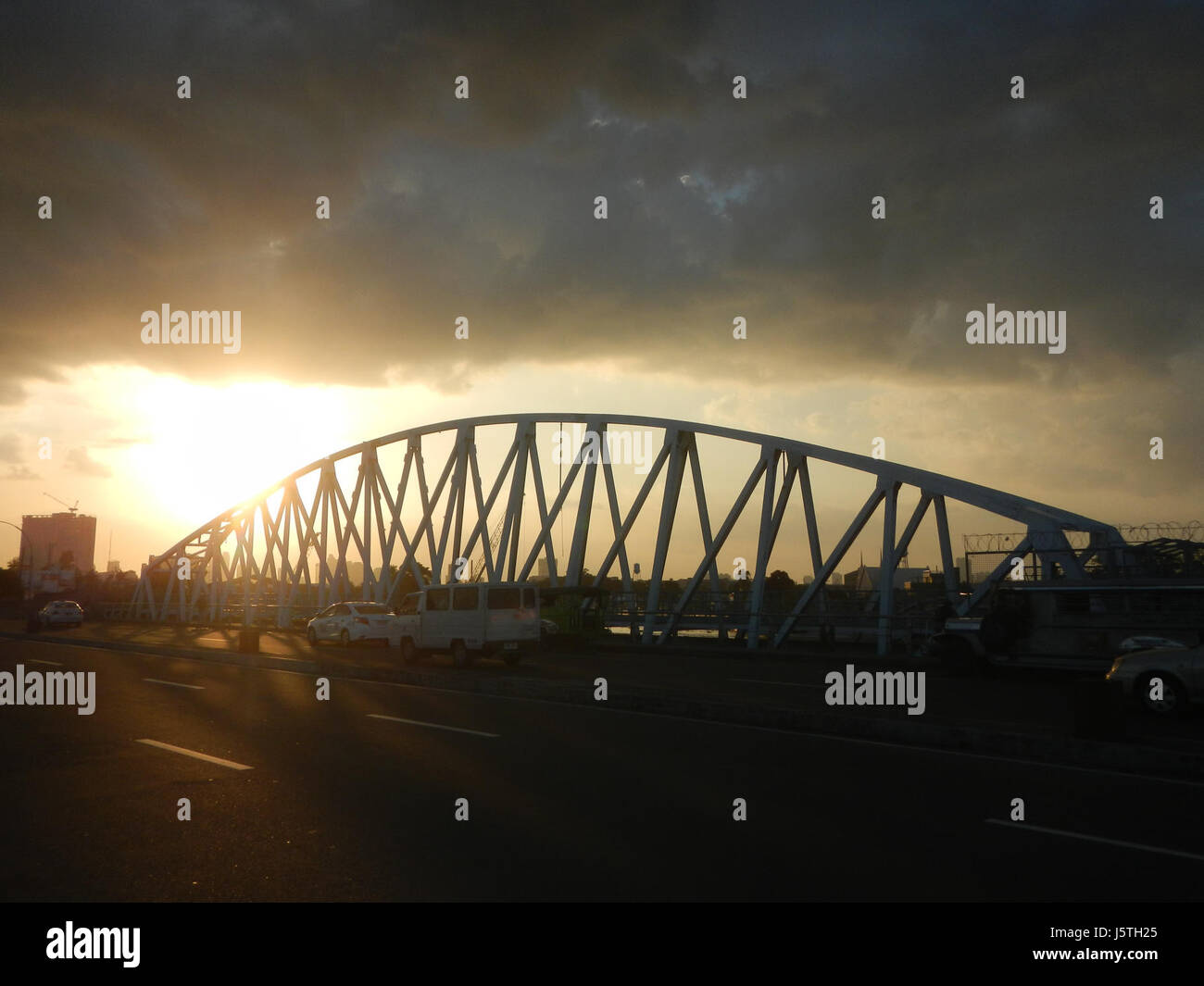 This bridge spans the Pasig River in Manila, connecting areas like ...
