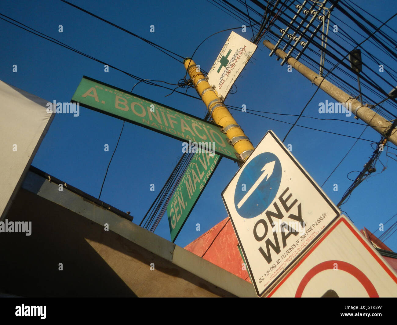 The title refers to a section of A. Bonifacio Avenue in Marikina City, known for its infrastructure, including a bridge crossing the City River, highlighting urban development and city planning. Stock Photo