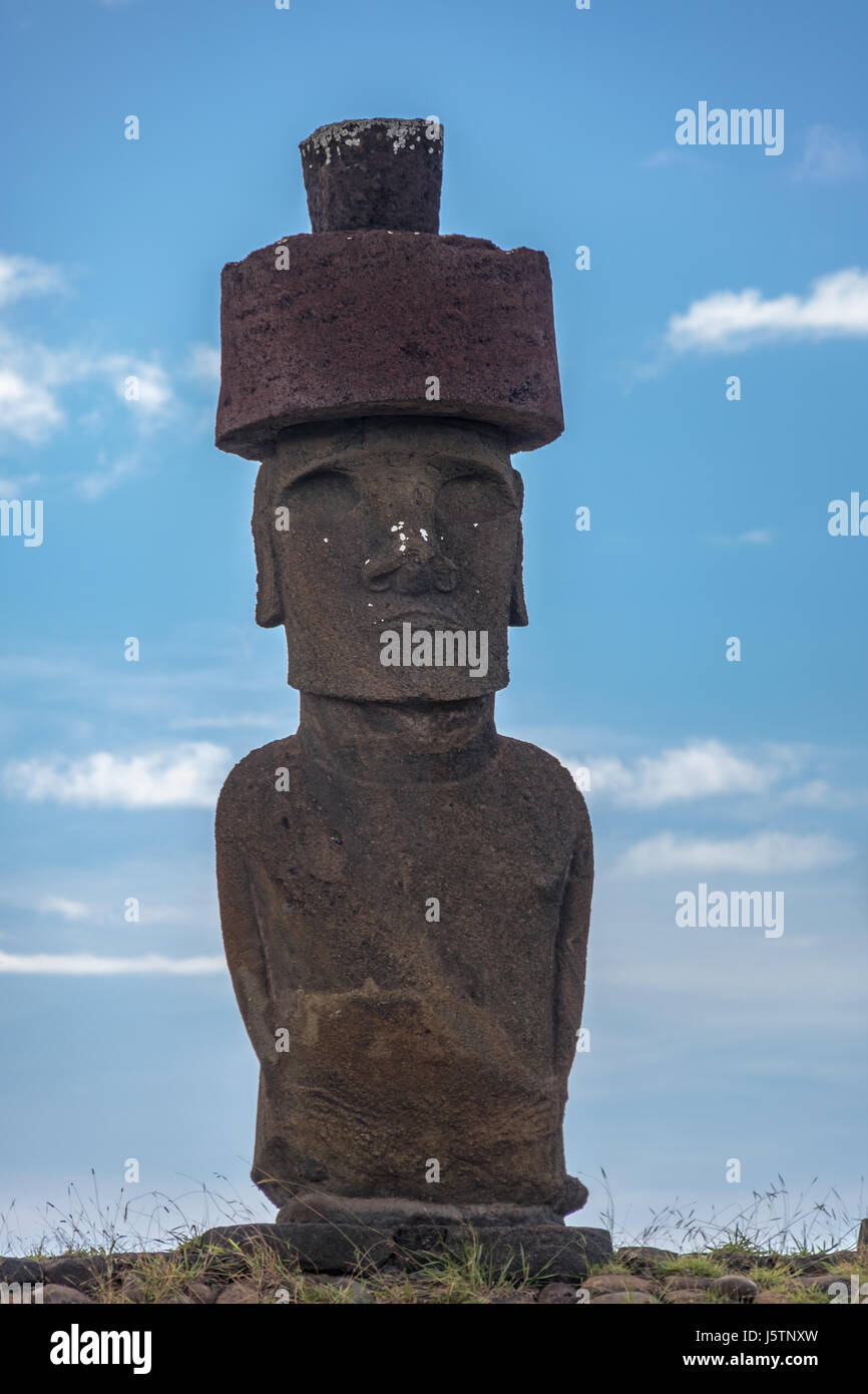 Moai Statue of Ahu Nau Nau wearing topknots near Anakena Beach - Easter Island, Chile Stock Photo