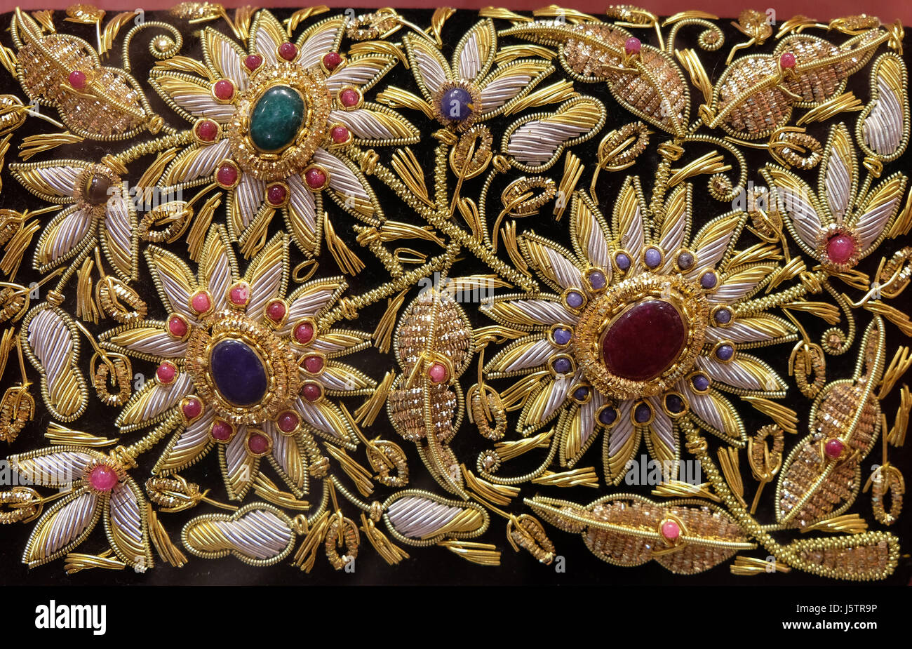 Handmade embroidered pillows on display at souvenir shop in Agra, Uttar