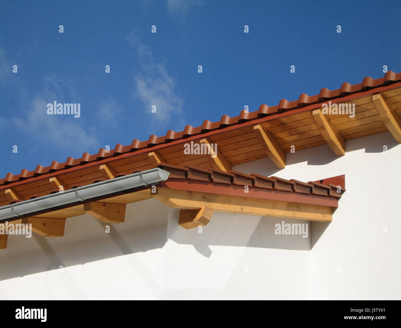 house building new building gutter eaves firmament sky rooftop blue